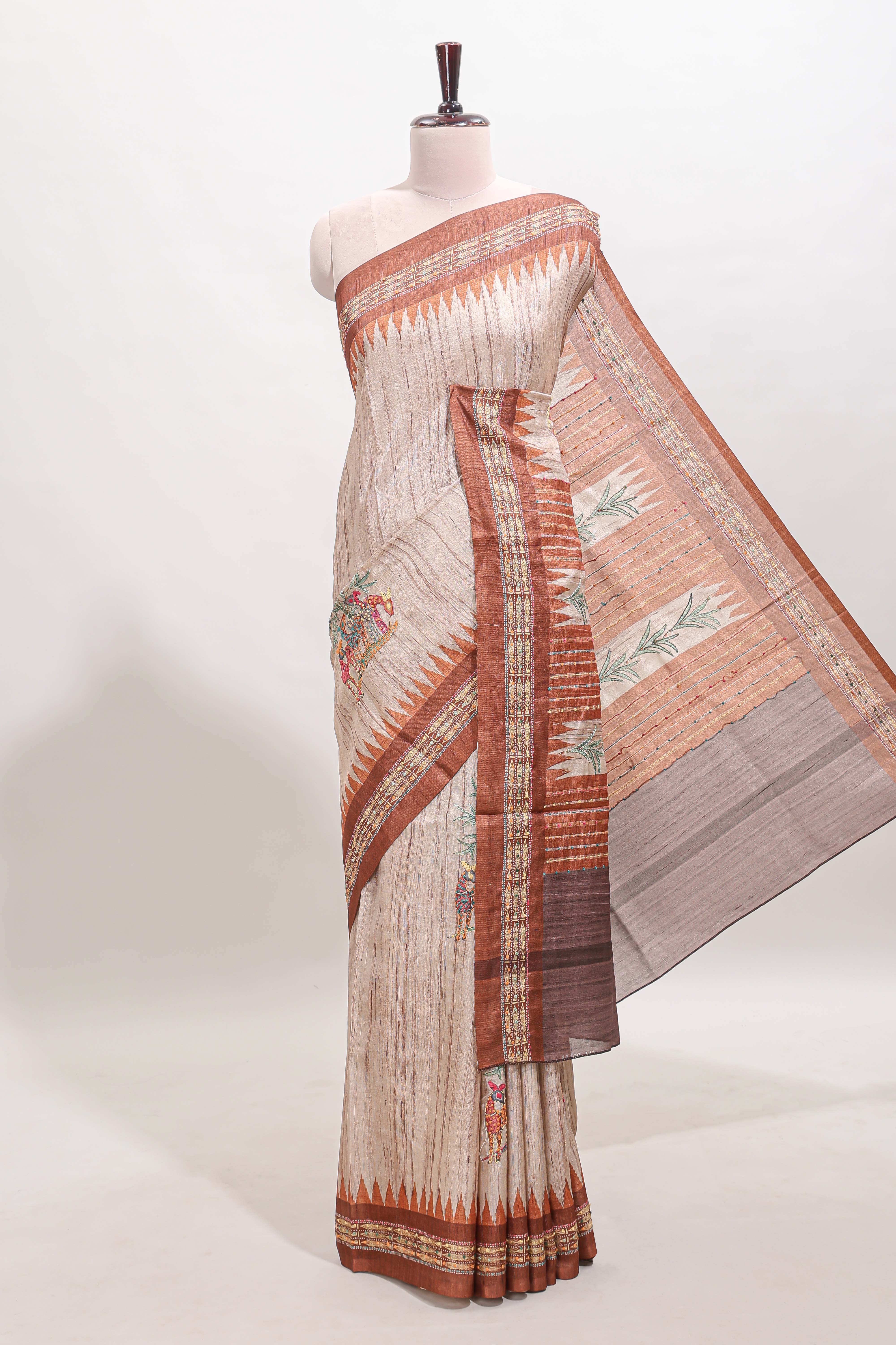 Tussar saree in beige tone delicate floral embroidery featuring rust-brown borders and woven pallu along with contrast blouse
