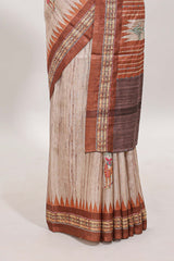 Tussar saree in beige tone delicate floral embroidery featuring rust-brown borders and woven pallu along with contrast blouse