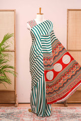 White Modal Silk Saree Detailing Vertical Green Stripes That Add a Sleek and Elegant Touch. Highlighted Contrast Ajrakh Print Pallu Along With Blouse