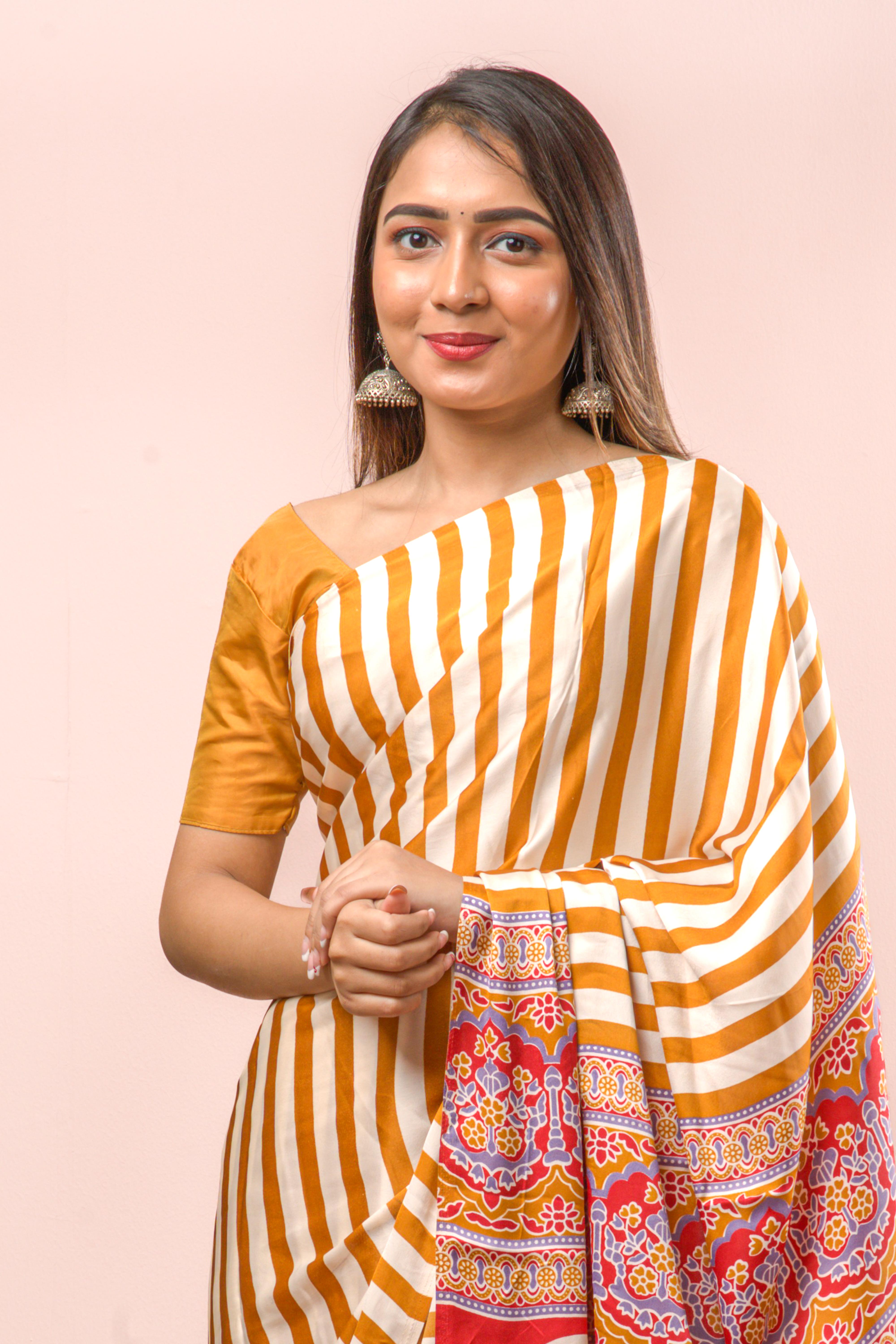 Modal Silk Sareehe Body Has Contrast Vibrant Yellow Vertical Stripes The Pallu Are Highlighted Ajrakh Design Along With Blouse