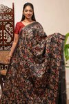 Black floral design tussar saree with self zari border and matching blouse