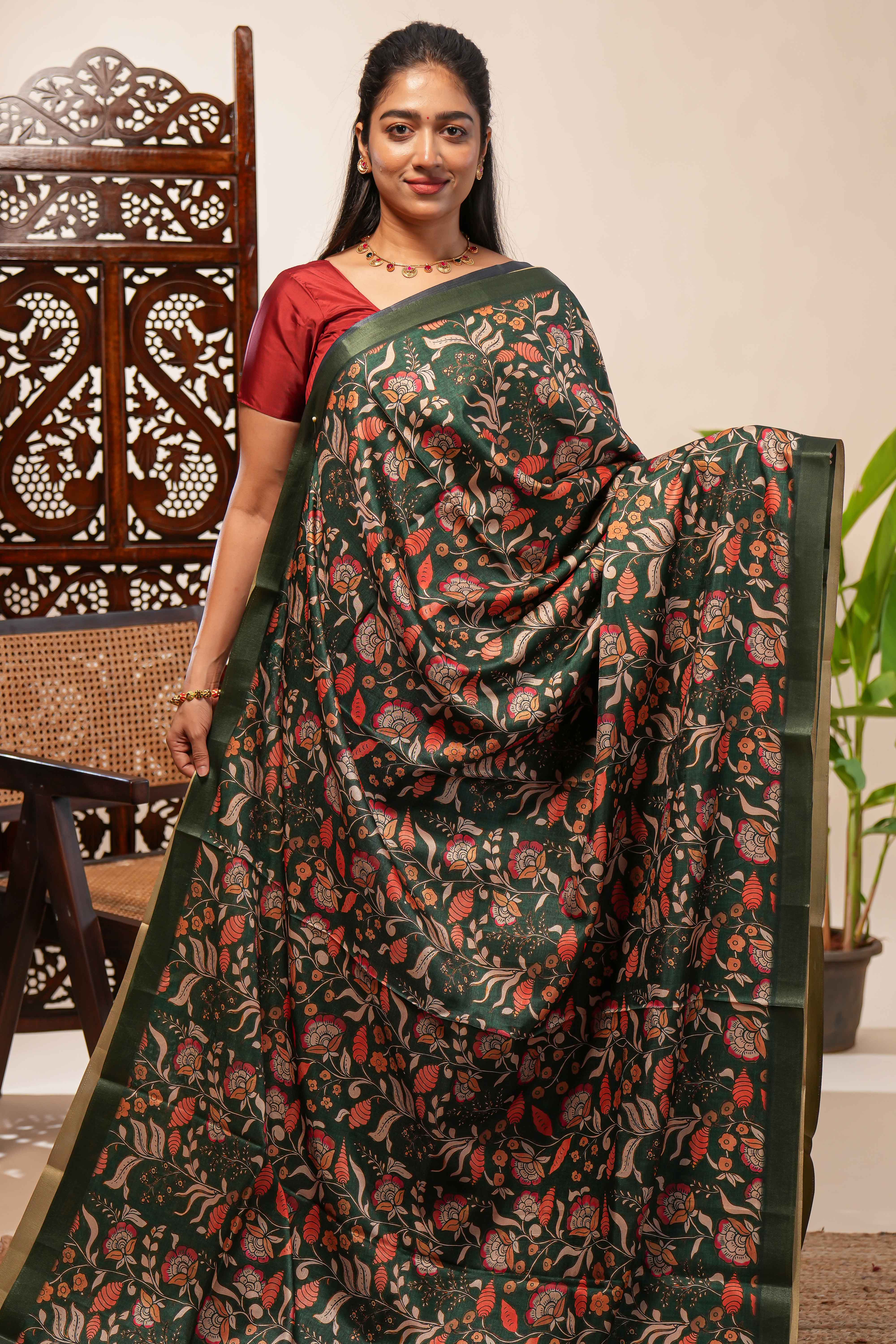 Green floral design tussar saree with self zari border and matching blouse