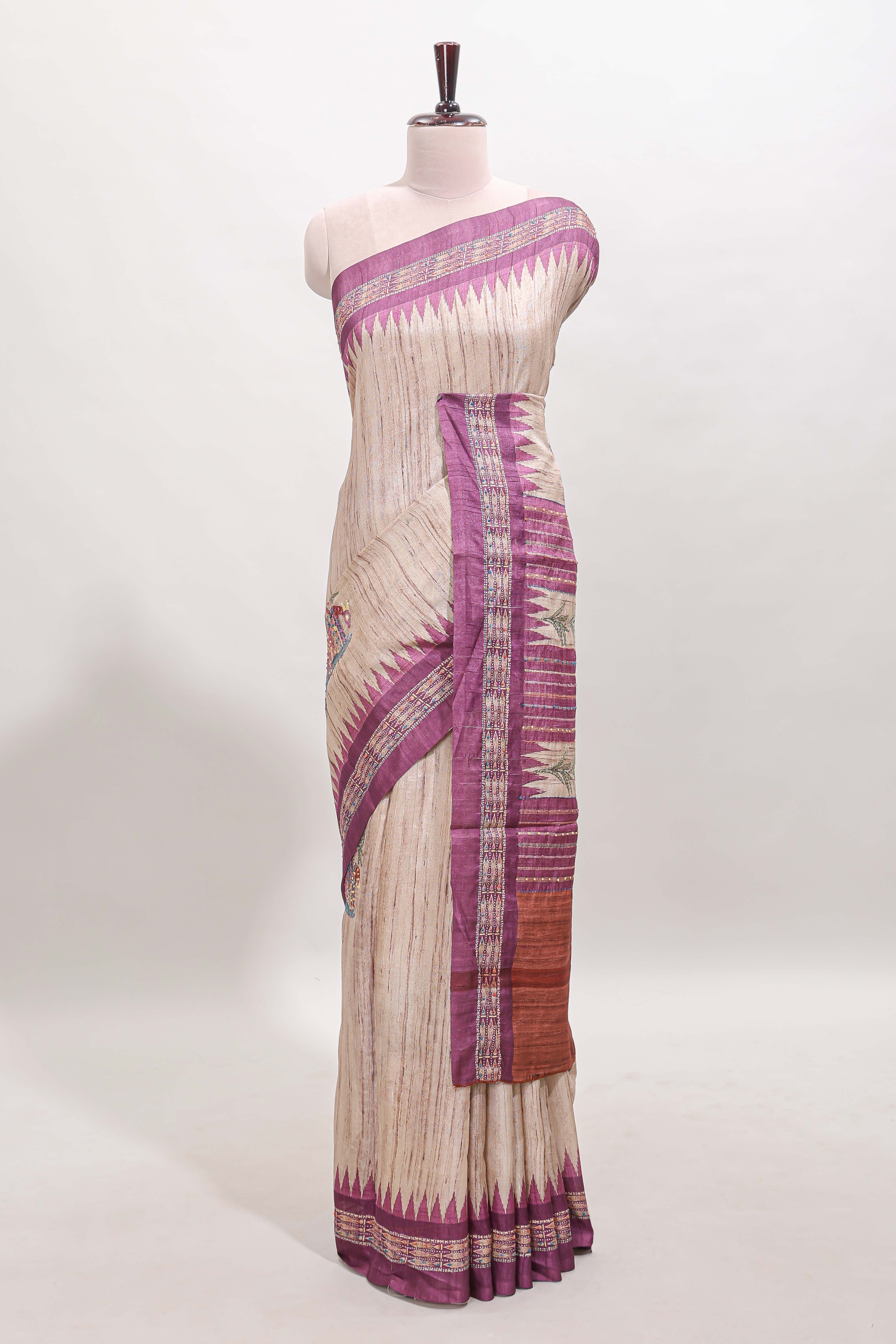 Tussar saree in beige tone delicate floral embroidery featuring violet borders and woven pallu along with contrast blouse