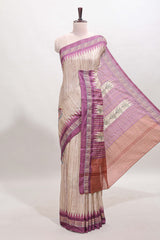 Tussar saree in beige tone delicate floral embroidery featuring violet borders and woven pallu along with contrast blouse