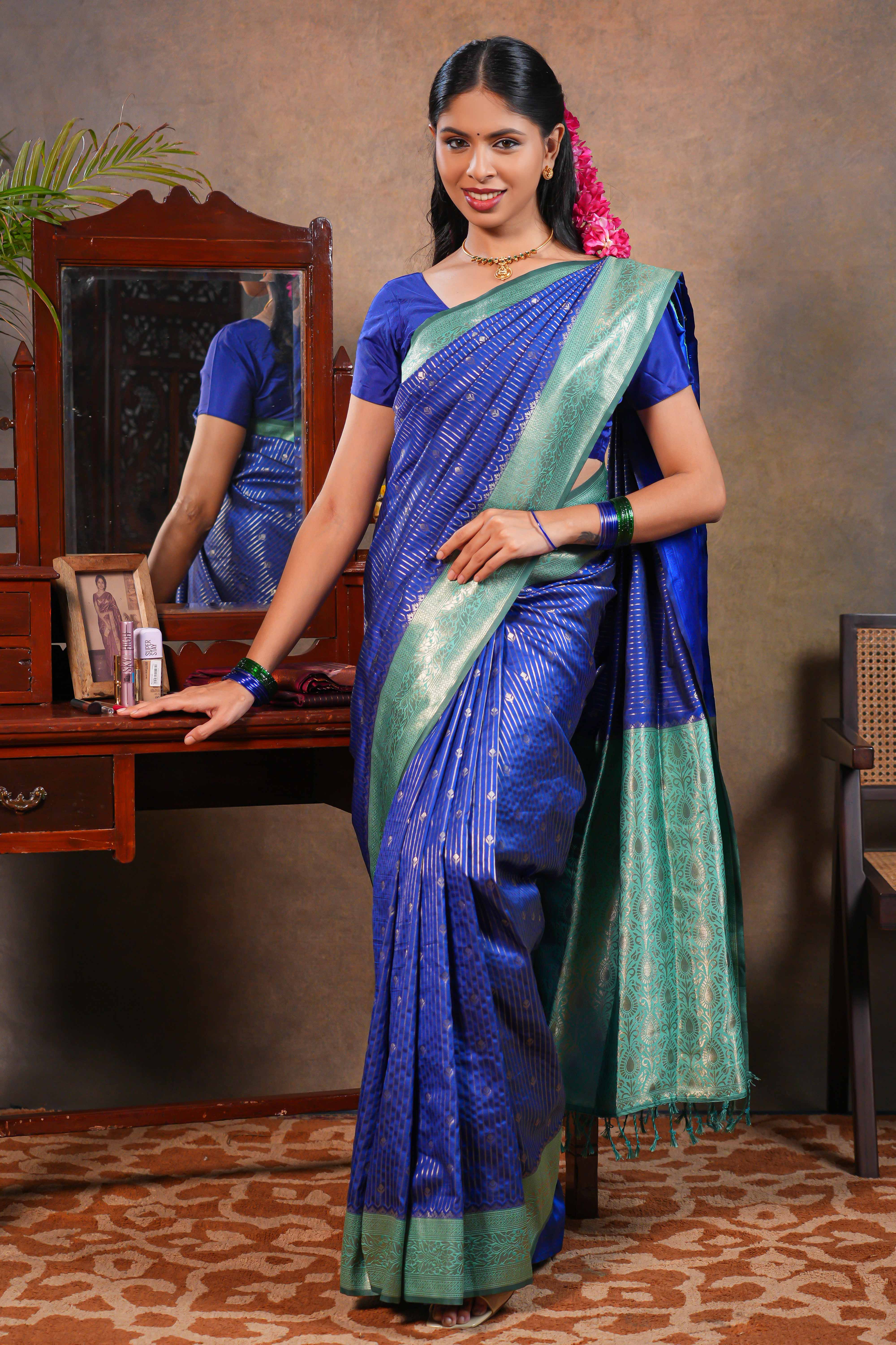 Blue colour Semi Silk Saree Gold Zari Lines and small buttas with Woven Zari Border and Contrast Blouse