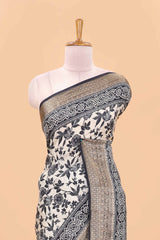 Cream assam silk saree with all over floral print, contrast zari border and pallu