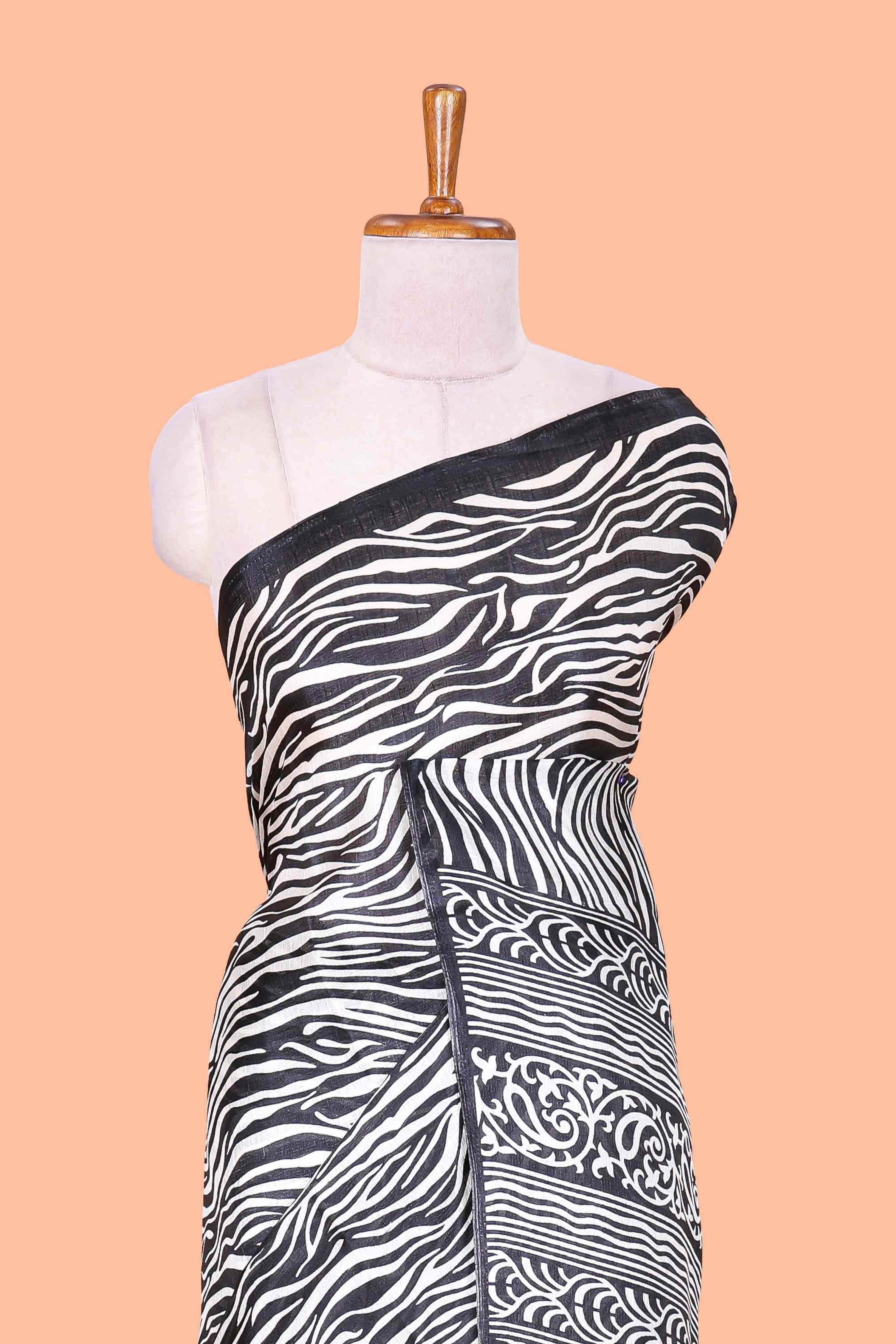 South cotton saree with zebra print all over body and pallu along with contrast blouse
