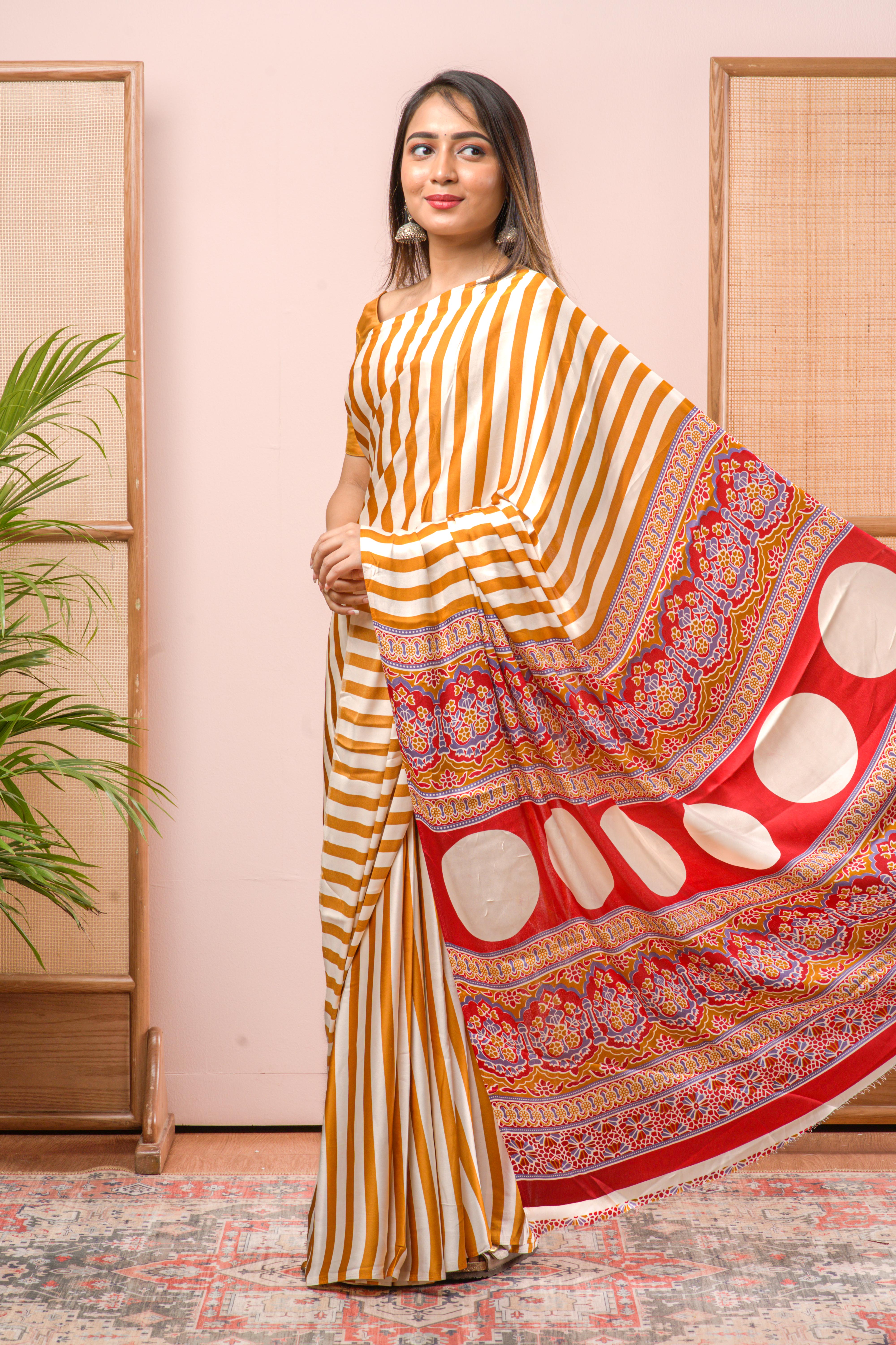 Modal Silk Sareehe Body Has Contrast Vibrant Yellow Vertical Stripes The Pallu Are Highlighted Ajrakh Design Along With Blouse