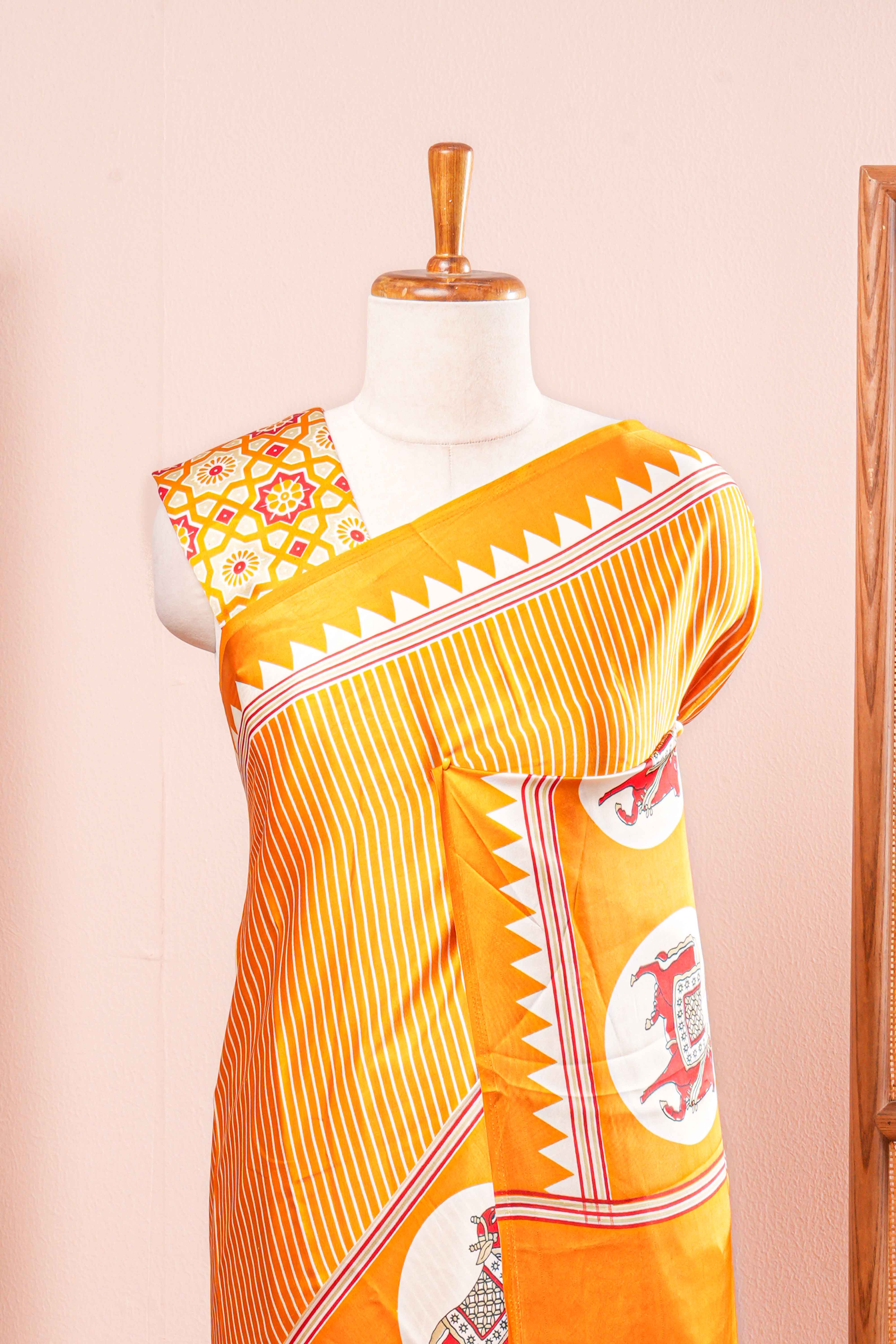 Vibrant Yellow Modal Silk Saree The Body Has Fine Vertical White Stripes The Border Are Highlighted Pichwai Design Along With Ajrakh Printed Blouse