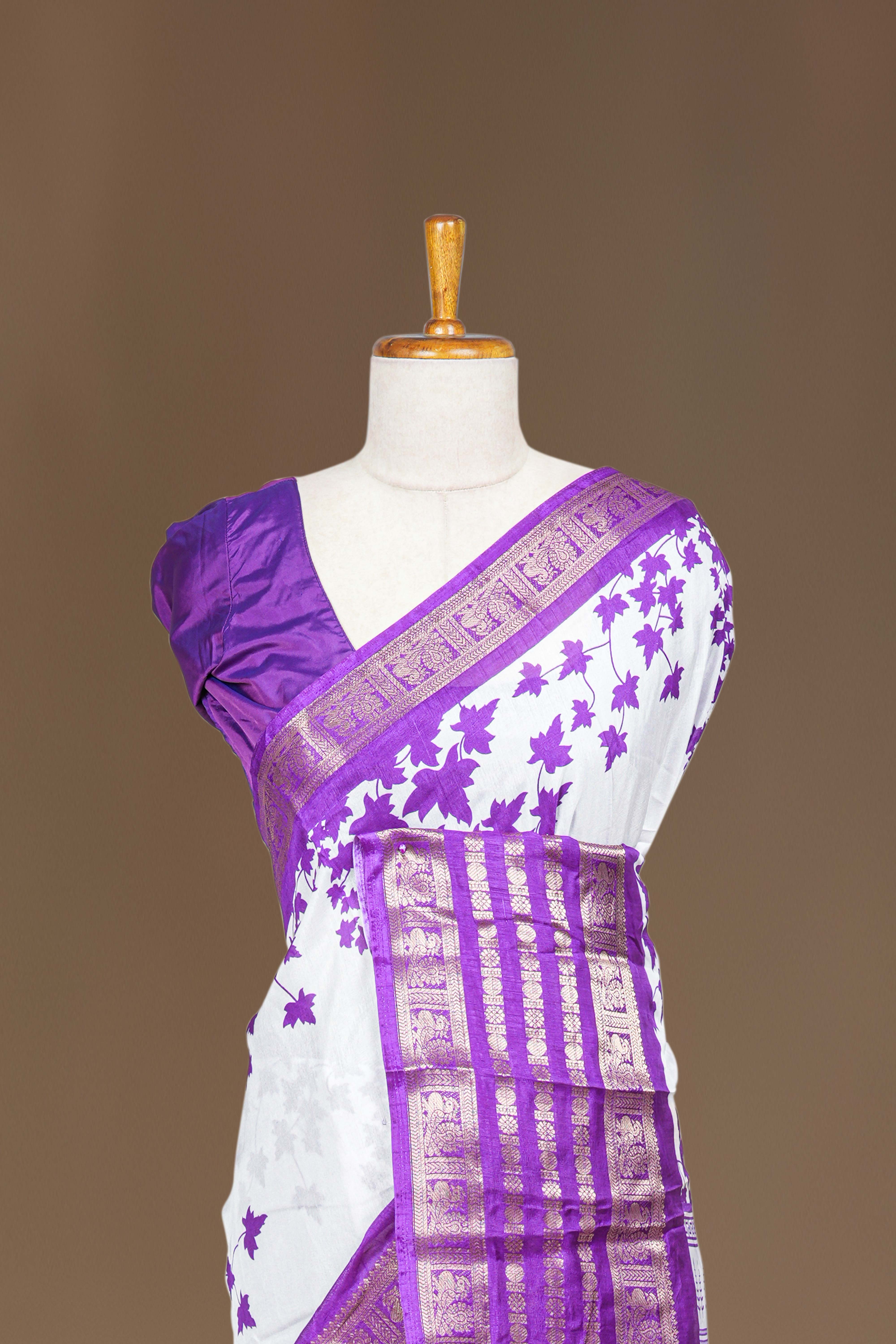White Dola Silk Saree Leaf Motifs Across The Body With Golden Zari Weaving Border Along With Contrast Blouse