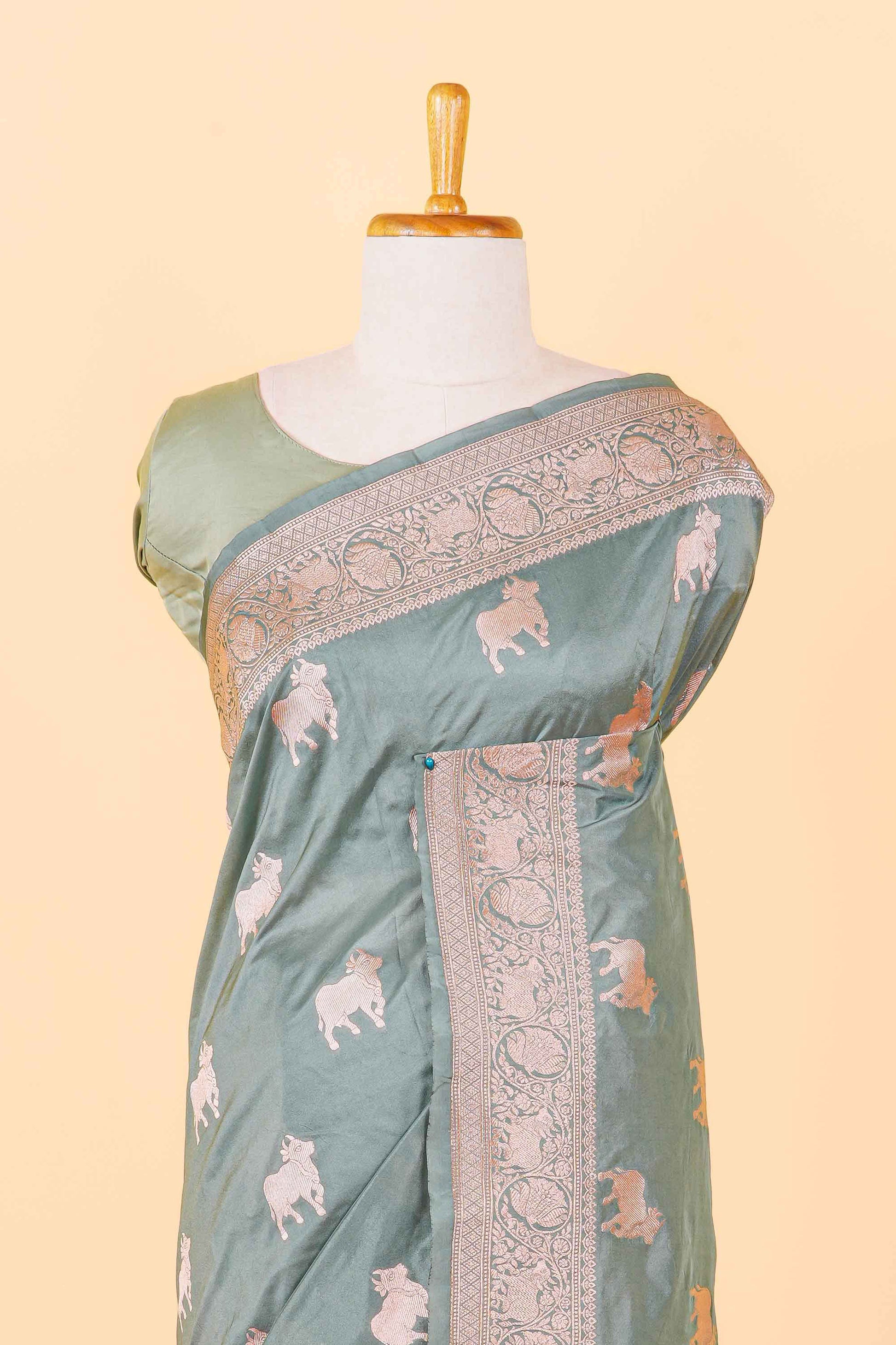 Green saree with elephant patterns