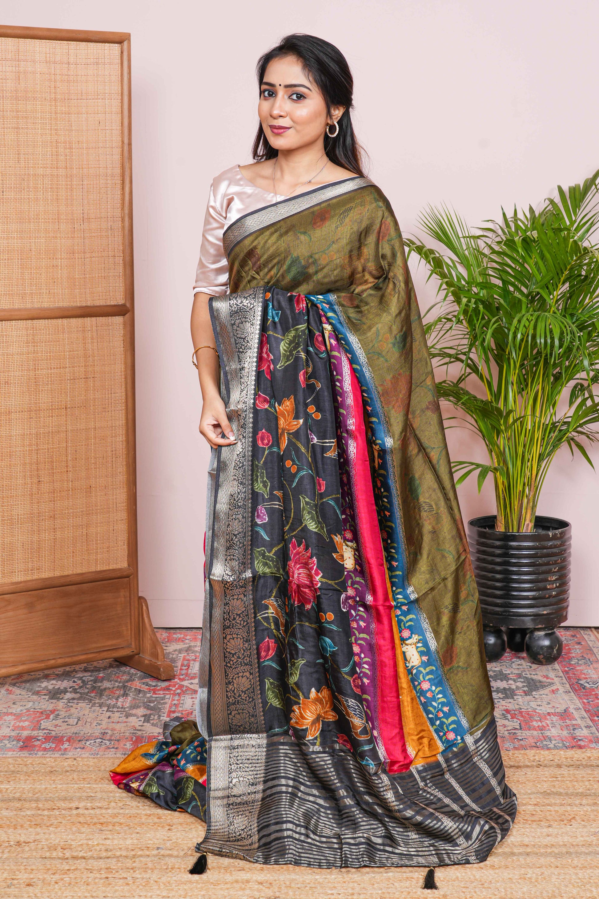 Woman wearing a traditional saree with a colorful pattern
