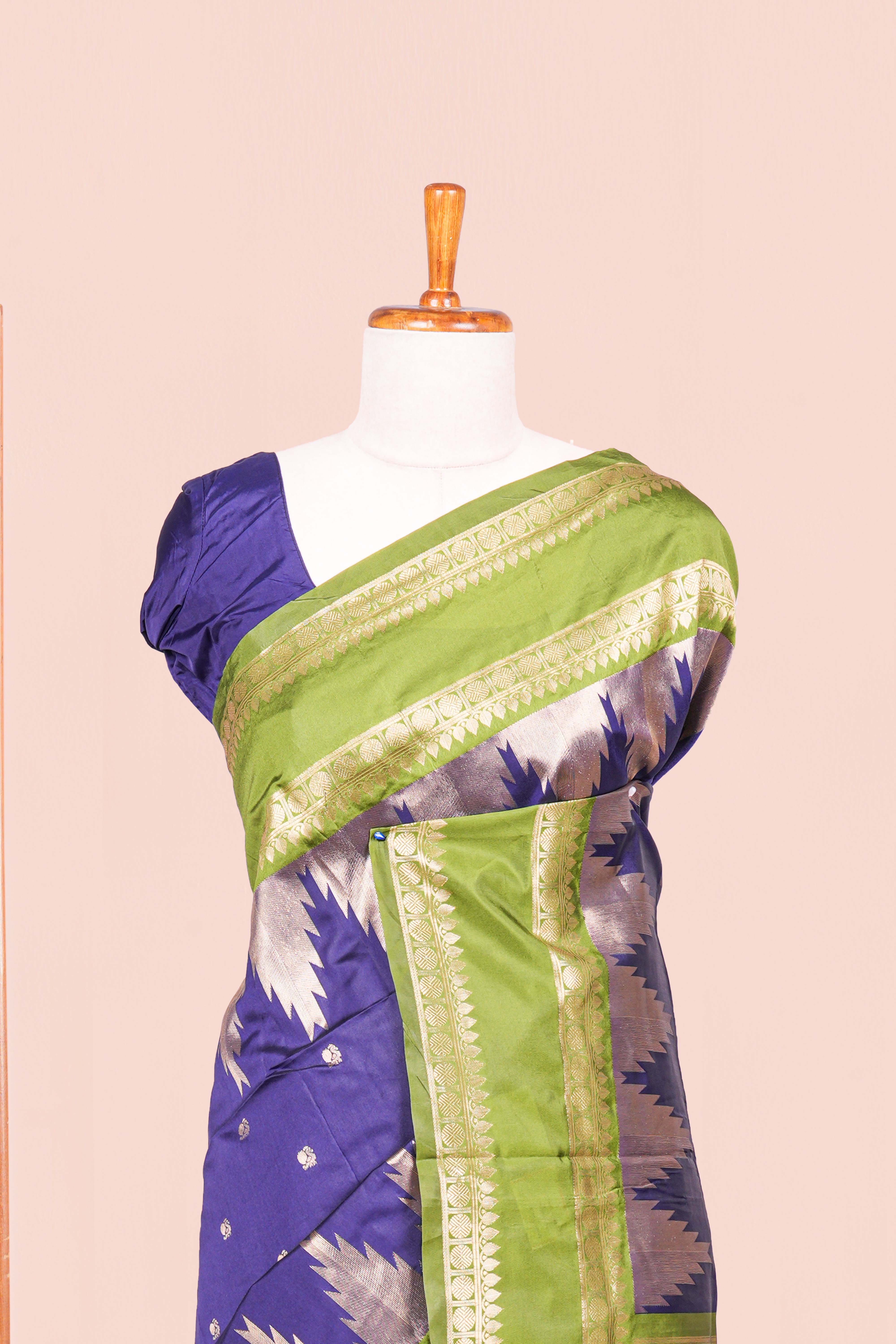 Blue Semi Art Silk Saree Delicate Golden Zari Motifs Along With Thalampoo Zari Woven Across The Body. The Border Is Broad With Intricate FloralZari Weaving Rich Golden Zari Pallu