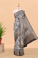 Cream assam silk saree with all over floral print, contrast zari border and pallu