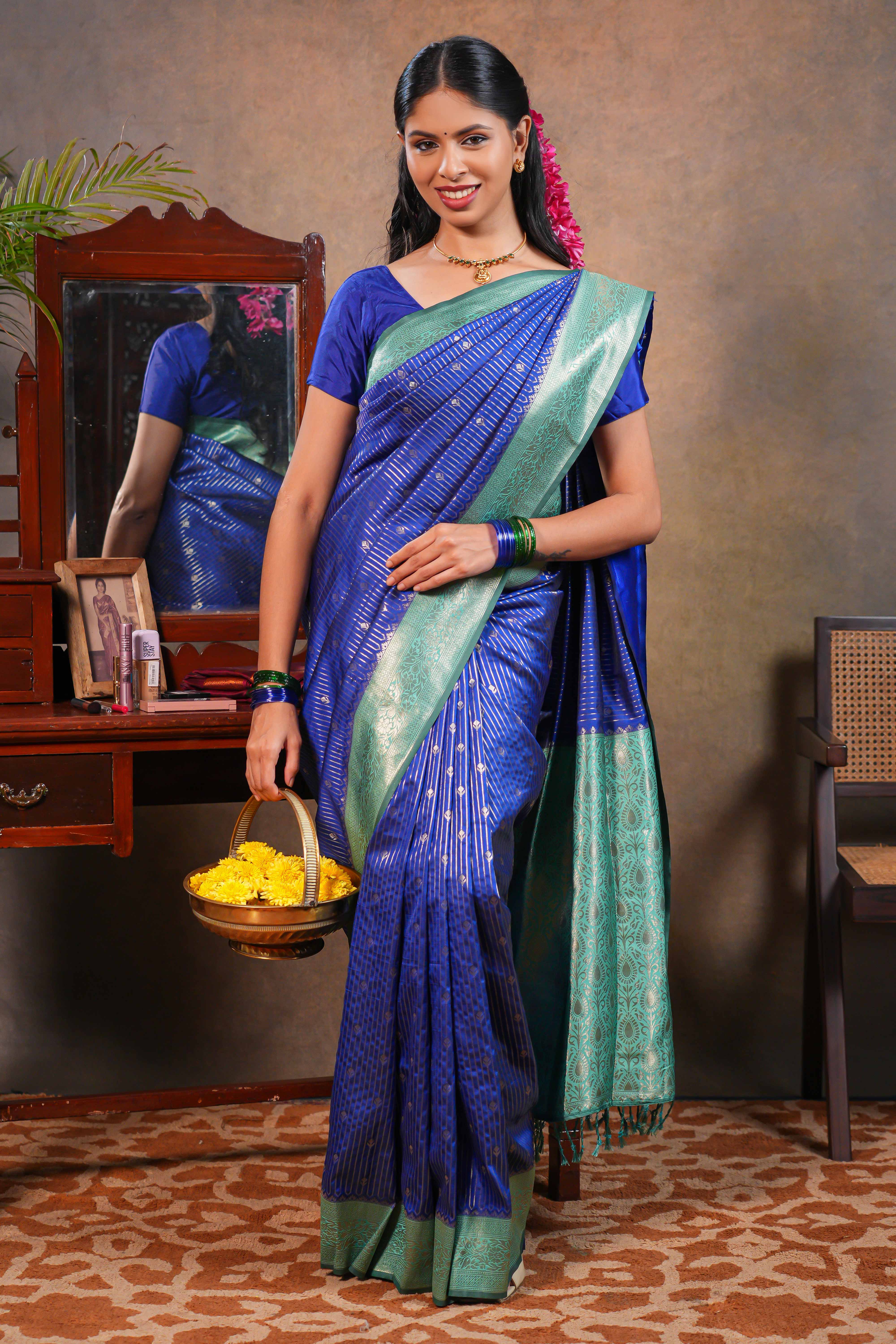 Blue colour Semi Silk Saree Gold Zari Lines and small buttas with Woven Zari Border and Contrast Blouse