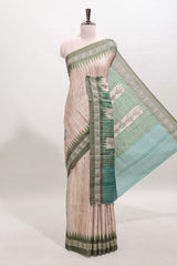 Tussar saree in beige tone delicate floral embroidery featuring dark green borders and woven pallu along with contrast blouse