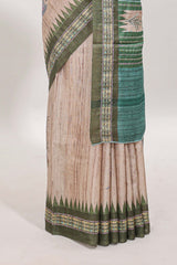Tussar saree in beige tone delicate floral embroidery featuring dark green borders and woven pallu along with contrast blouse