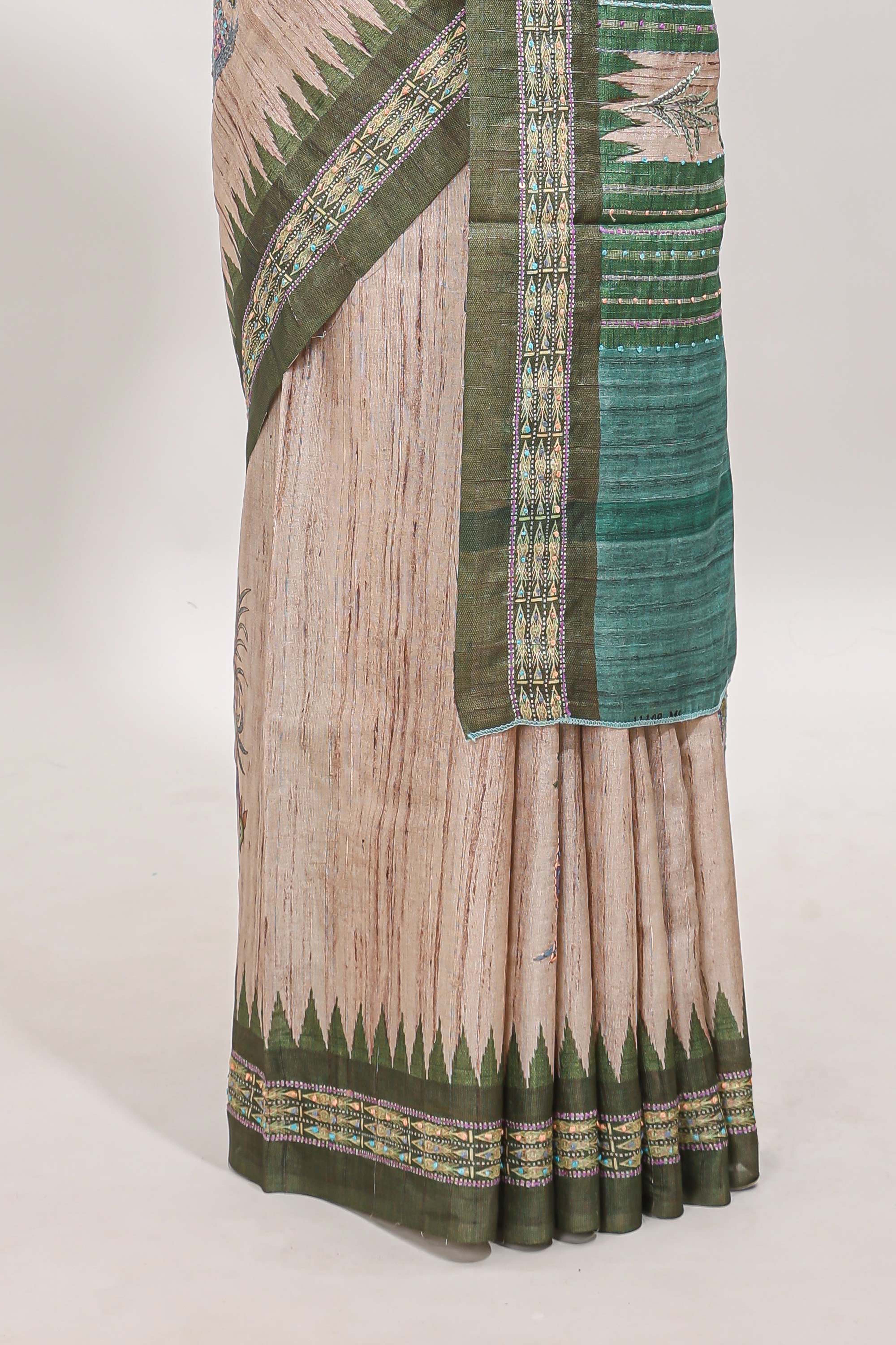 Tussar saree in beige tone delicate floral embroidery featuring dark green borders and woven pallu along with contrast blouse