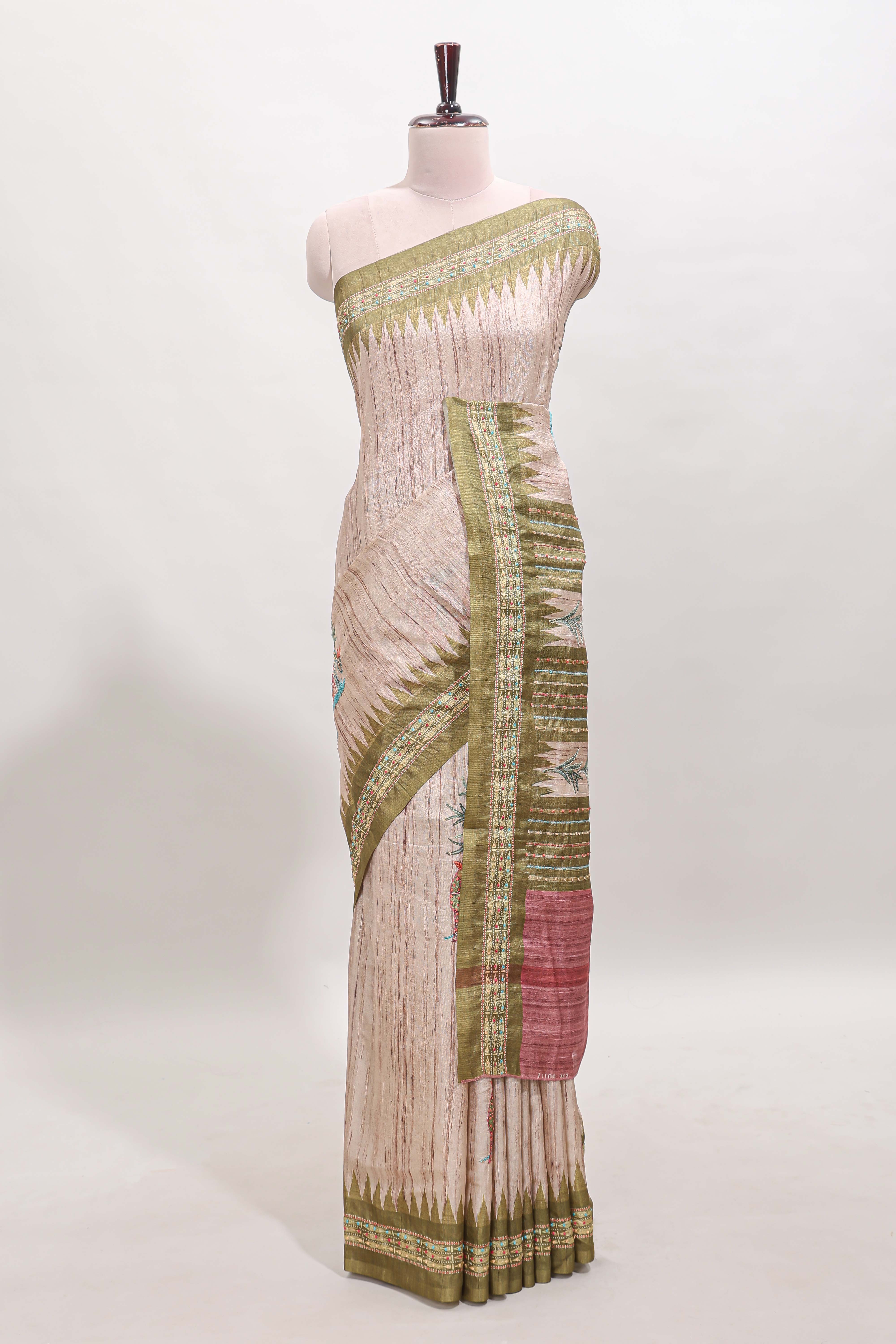 Tussar saree in beige tone delicate floral embroidery featuring green borders and woven pallu along with contrast blouse