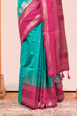 Rama Green Semi Art Silk Saree Delicate Golden Zari Motifs Along With Thalampoo Zari Woven Across The Body. The Border Is Broad With Intricate Floral Zari Weaving Rich Golden Zari Pallu