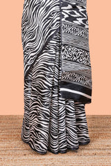 South cotton saree with zebra print all over body and pallu along with contrast blouse