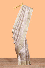 Beige motifs design art tissue saree with contrast border and crush design blouse
