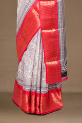 White Dola Silk Saree Pen Kalamkari Print Across The Body With Contrast Floral Zari Weaving Border Along With Zari Stripes Blouse