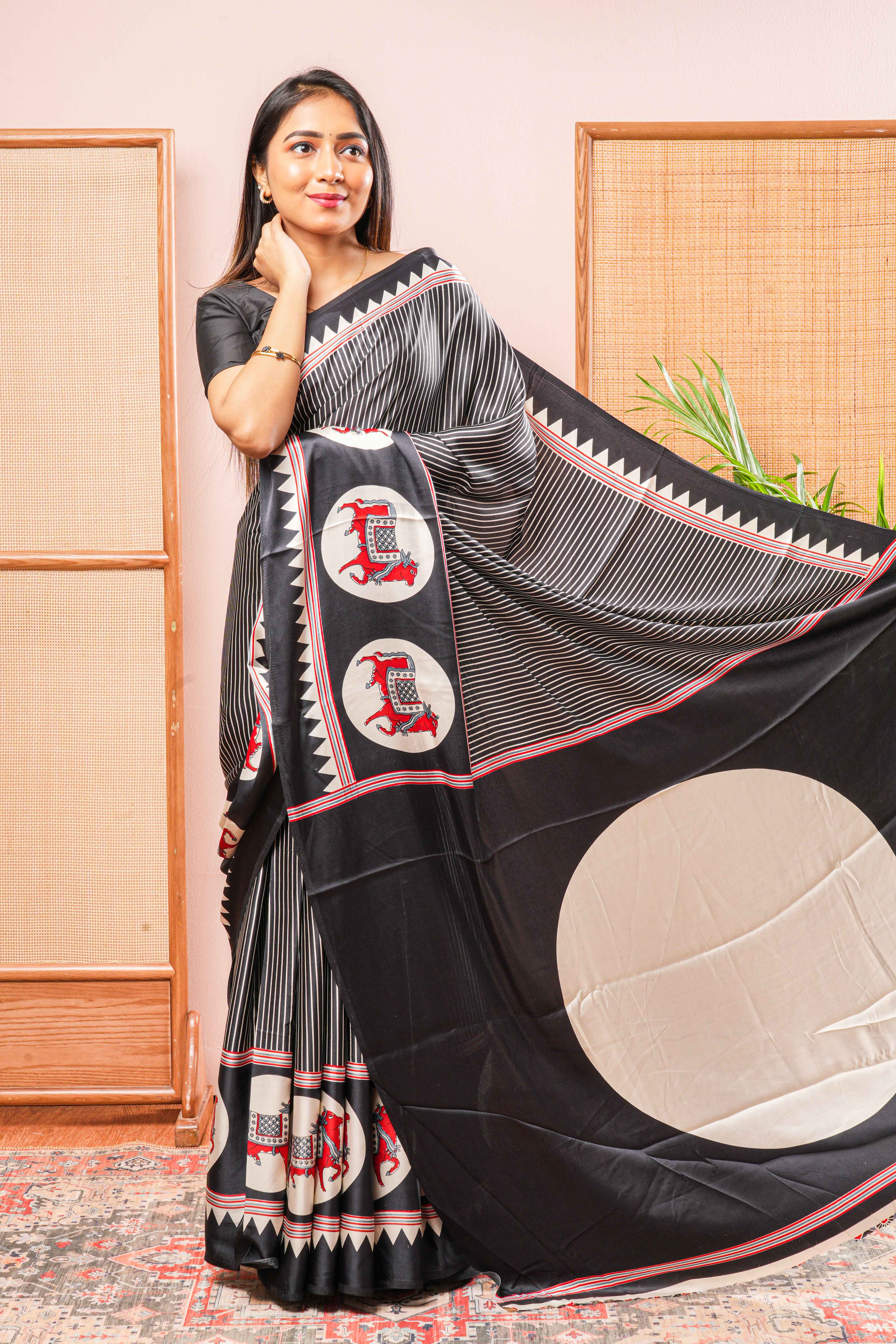 Black Modal Silk SareeThe Body Has Fine Vertical White StripesThe Border Are Highlighted Pichwai Design Contrast Coin Motifs In PalluAlong With AjrakhPrinted Blouse
