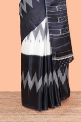 Black & white geometric ikkat style south cotton saree with striped pallu and blouse