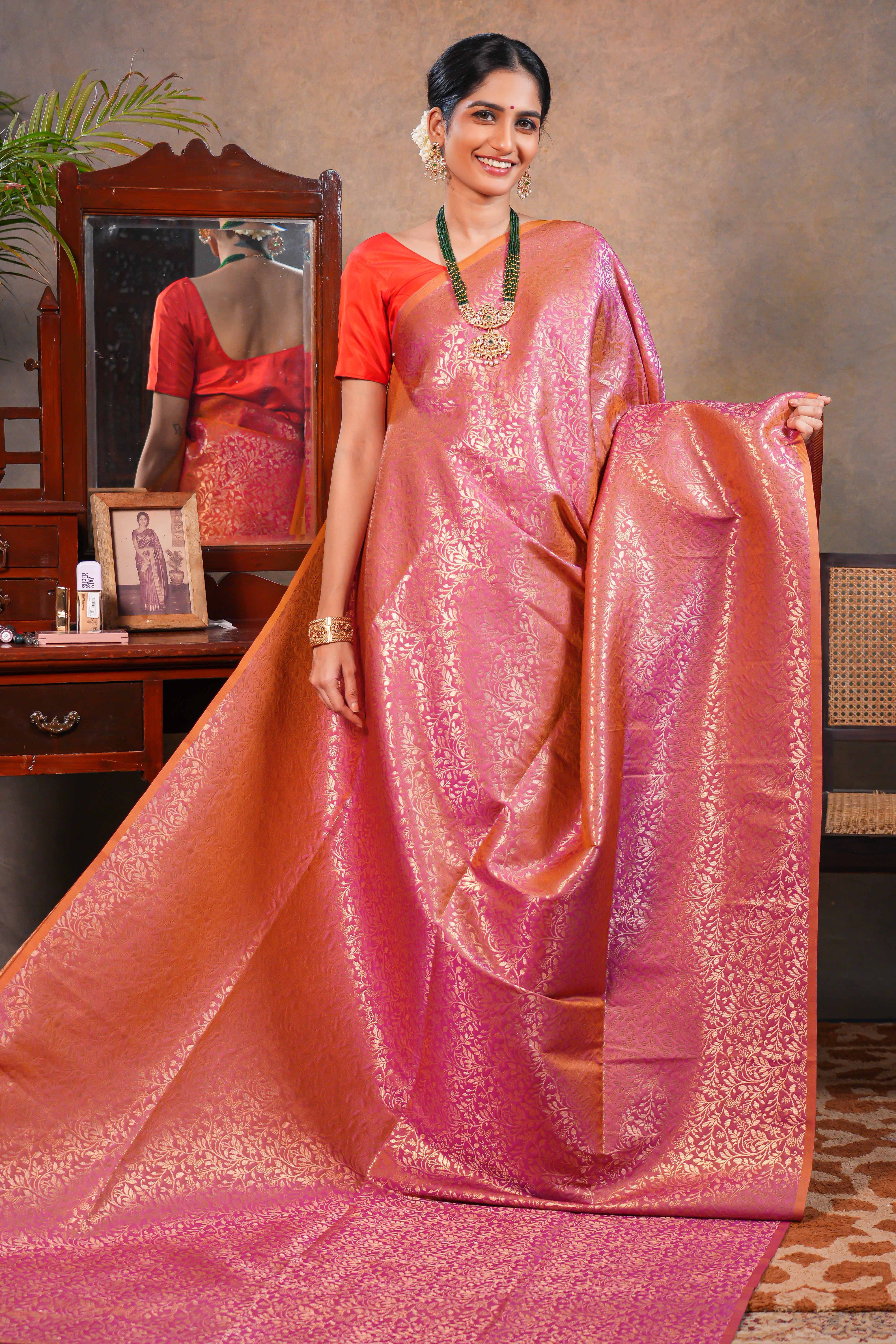 Rose Semi Soft Silk Saree with intricate gold zari floral vine weaving patterns and Rich zari woven pallu with Matching blouse
