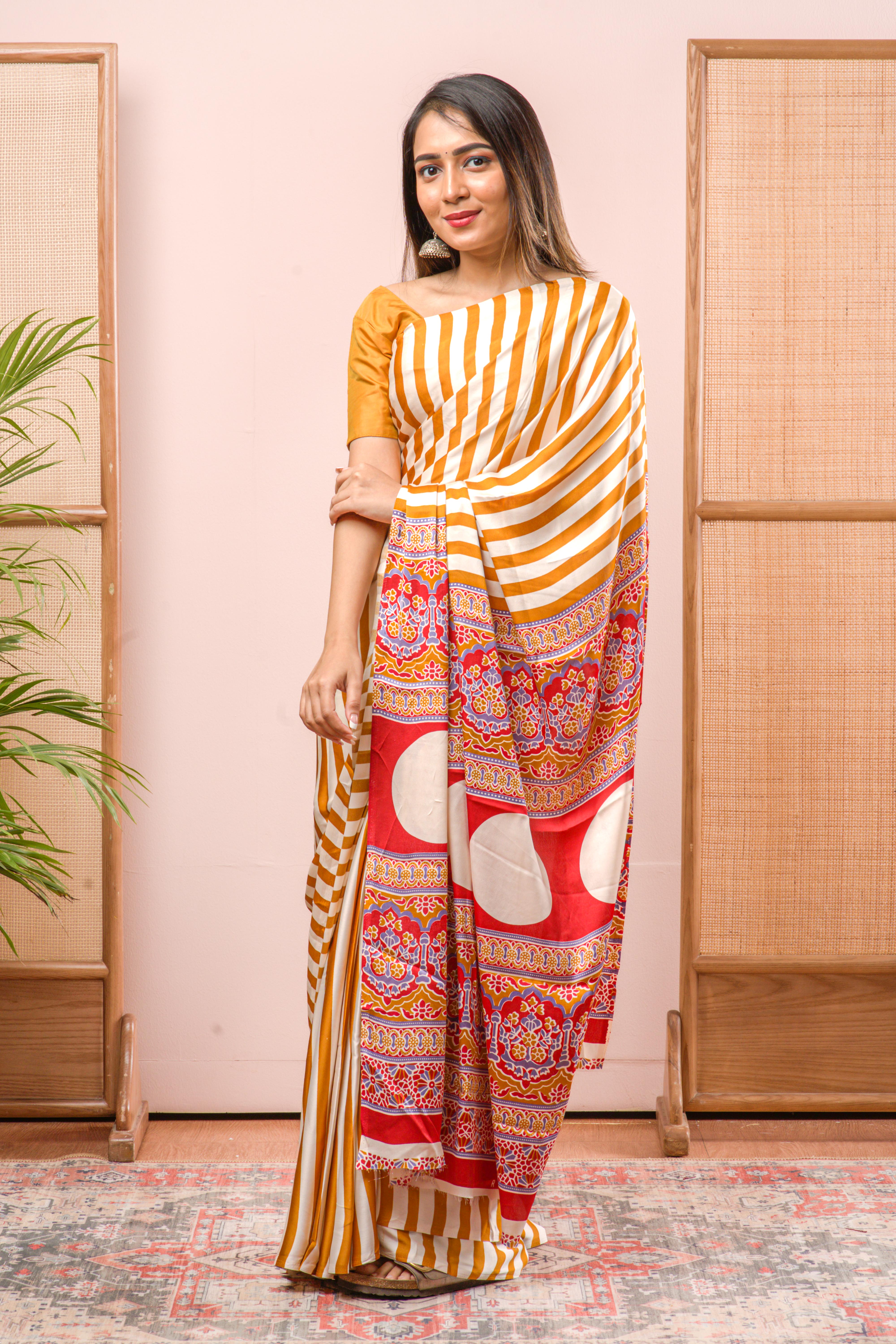 Modal Silk Sareehe Body Has Contrast Vibrant Yellow Vertical Stripes The Pallu Are Highlighted Ajrakh Design Along With Blouse