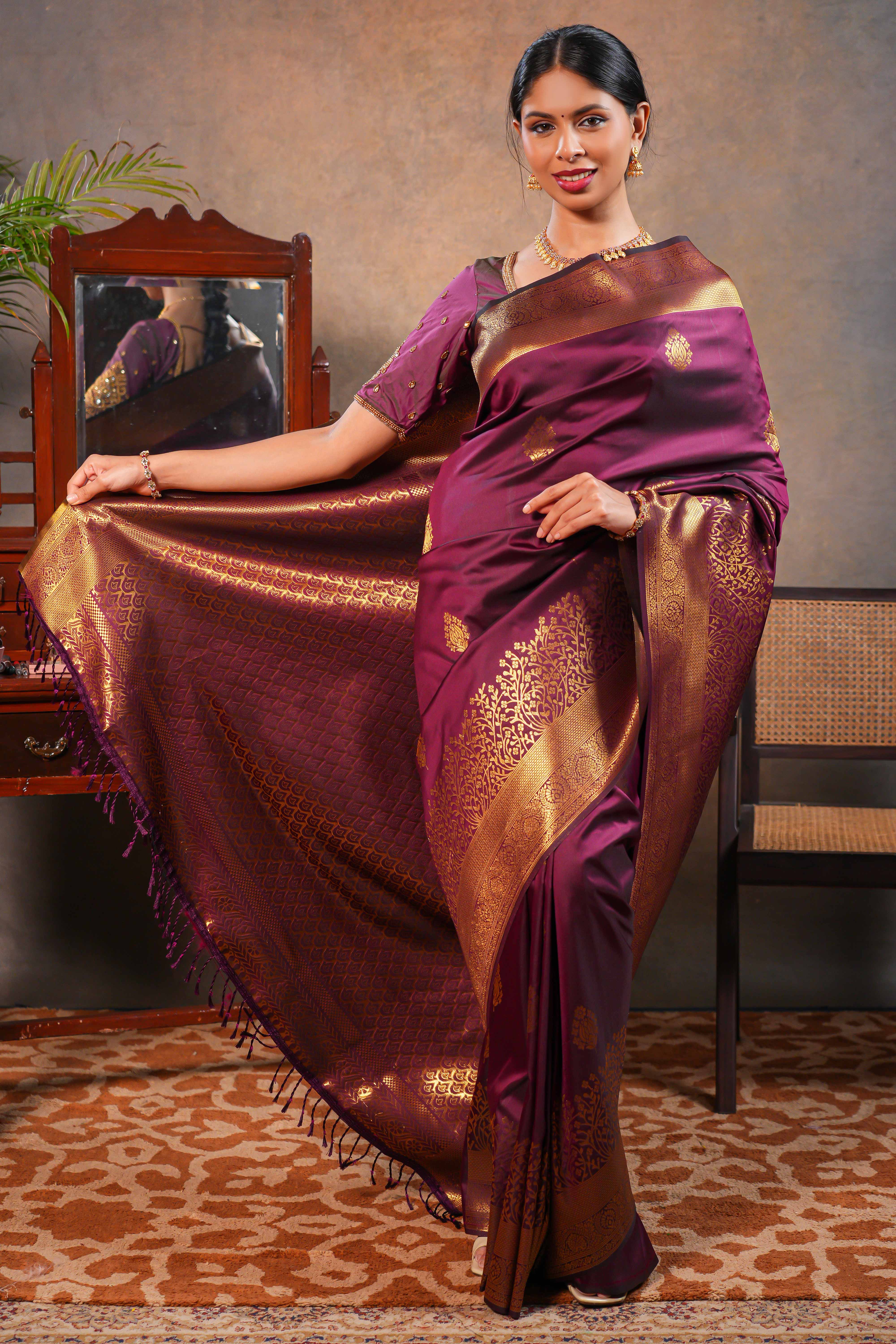 Maroon colour Semi soft Silk Saree Gold Zari Buttas design with Floral Woven Zari Border and Matching Blouse