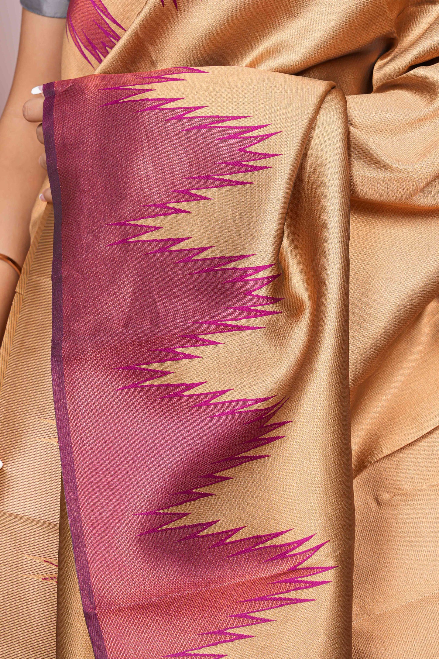 Beige saree with pink and purple border