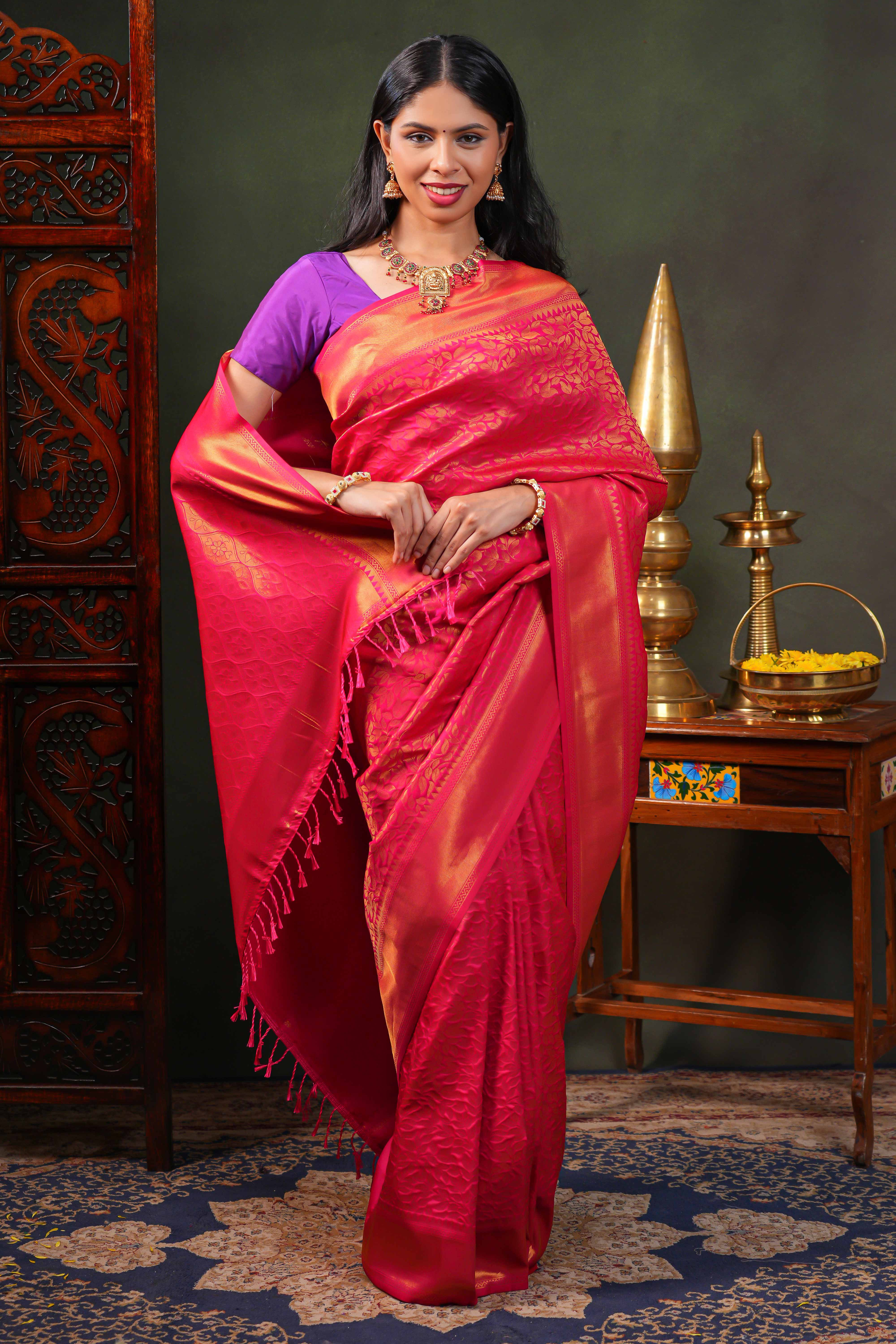 Pink colour Semi Soft Silk Saree with intricate gold zari Leaf vine weaving patterns and Rich zari woven pallu with Matching blouse