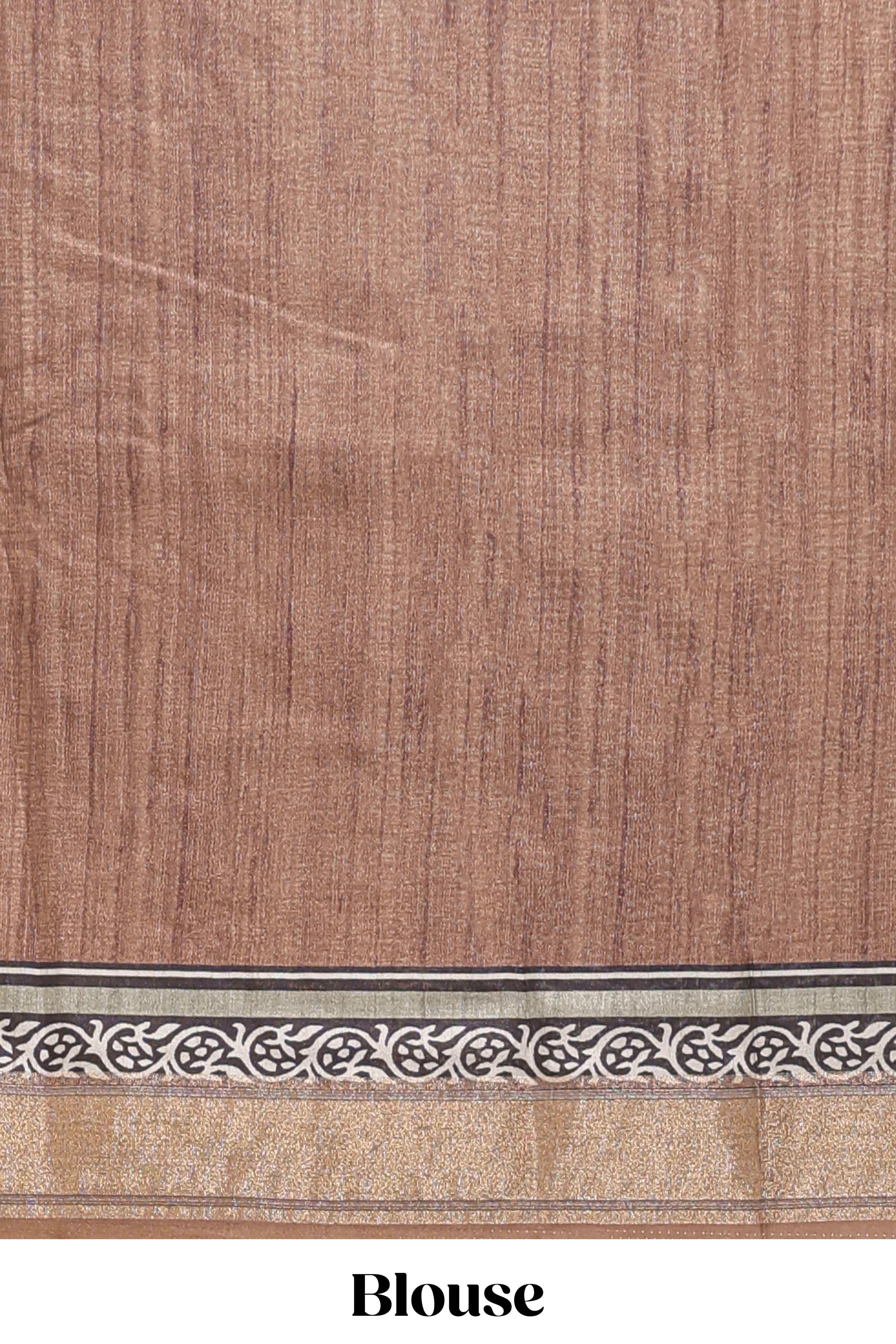 Elegant Tussar Saree with an earthy brown body ethnic prints intricate borders and tassel finished pallu along with contrast blouse