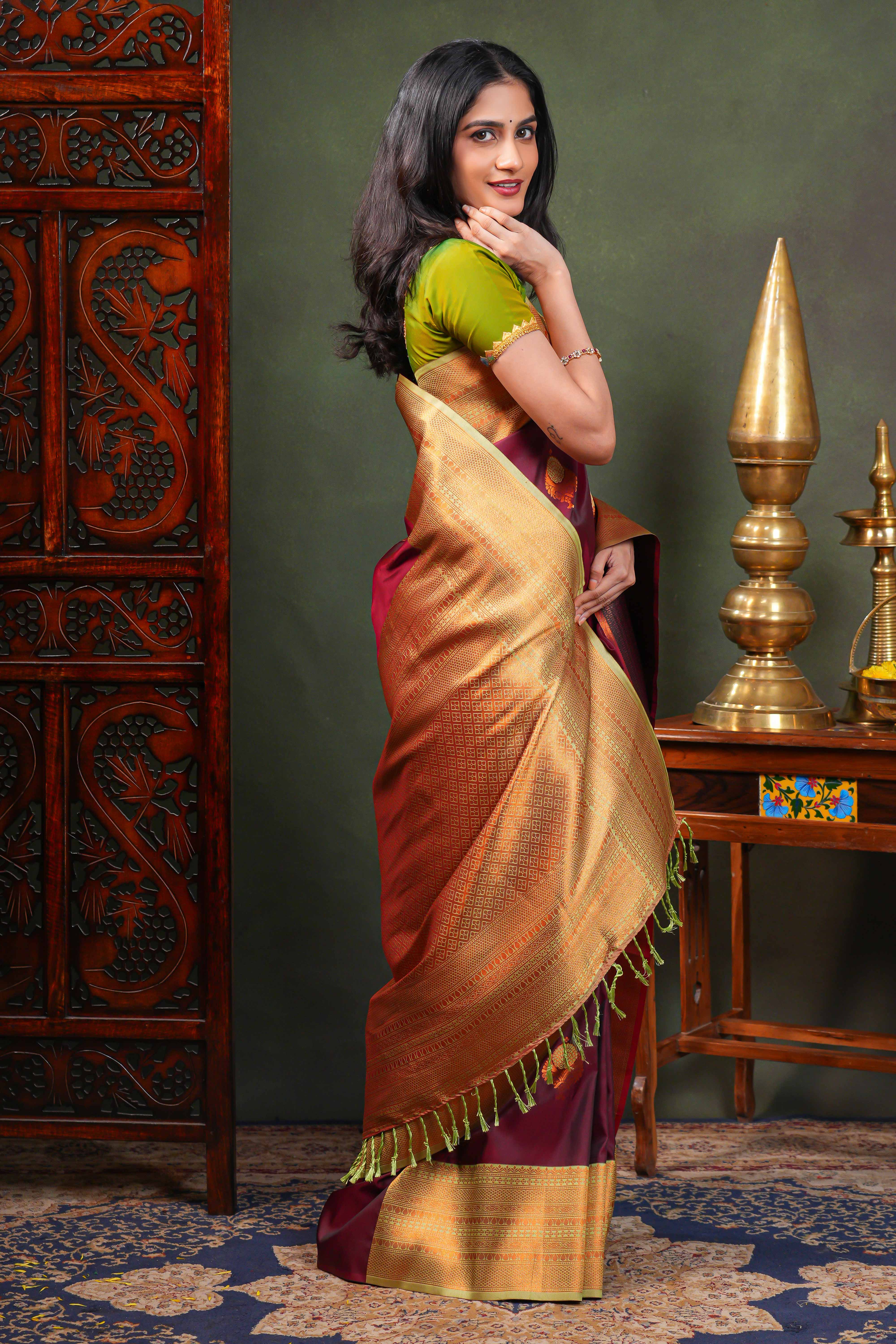 Maroon Semi Soft Silk Saree with elegant gold zari butta motifs gold zari woven Border with Contrast Blouse