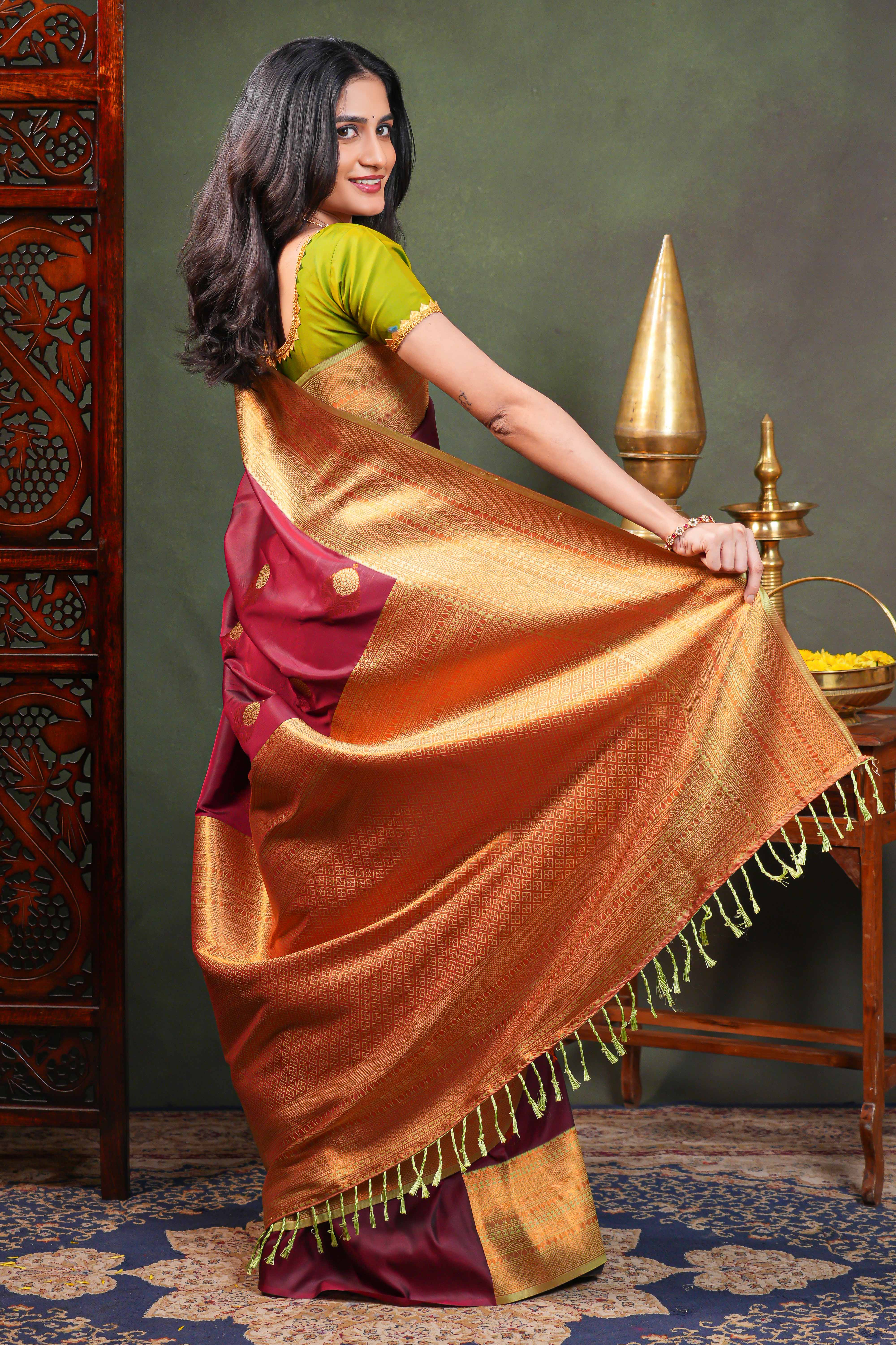 Maroon Semi Soft Silk Saree with elegant gold zari butta motifs gold zari woven Border with Contrast Blouse
