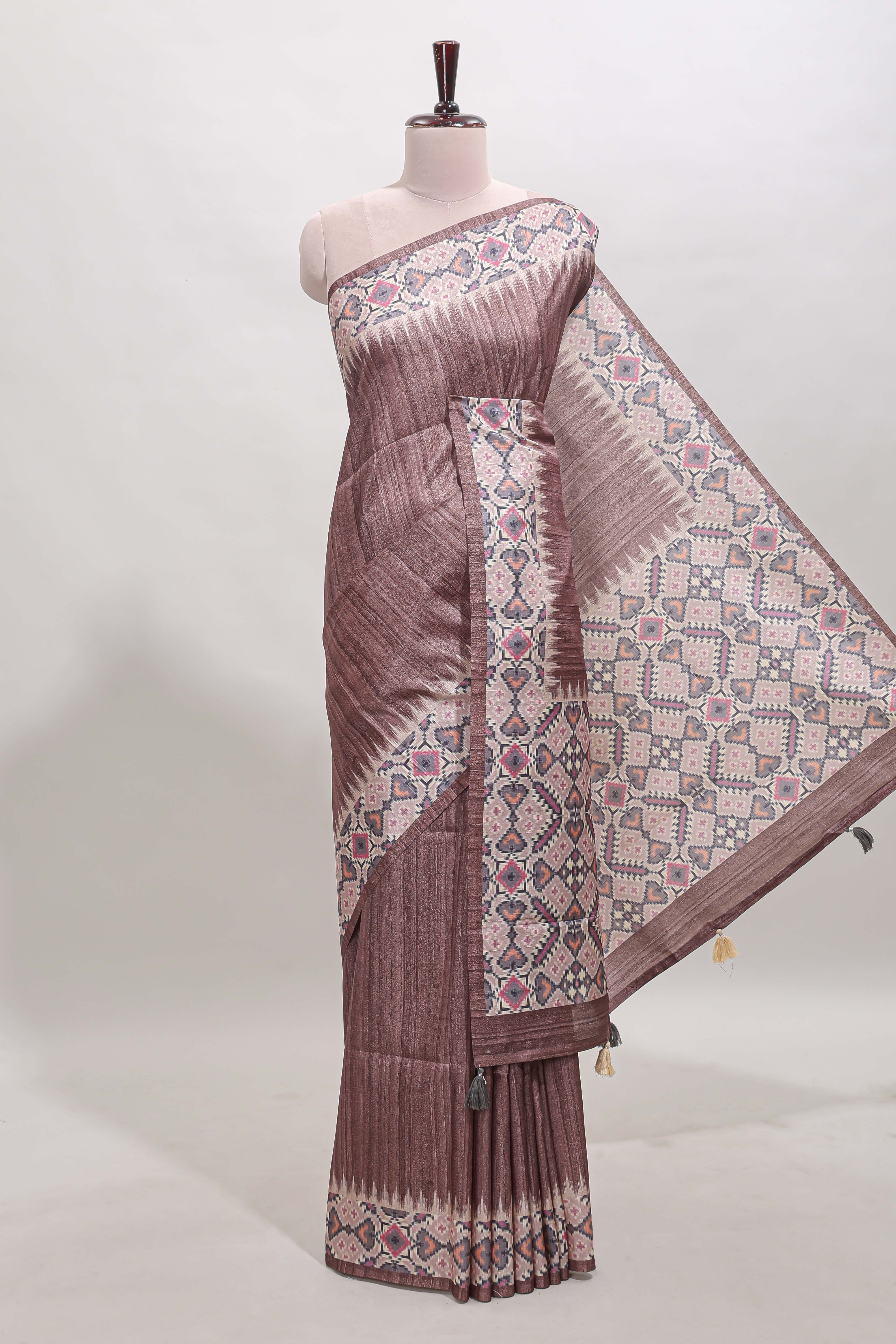 Tussar Silk Saree with a textured mauve body geometric woven border and a designer pallu with tassel along with blouse