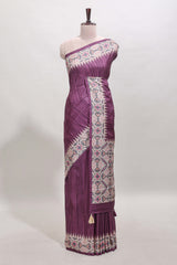 Tussar Silk Saree with a textured violet body geometric woven border and a designer pallu with tassel along with blouse