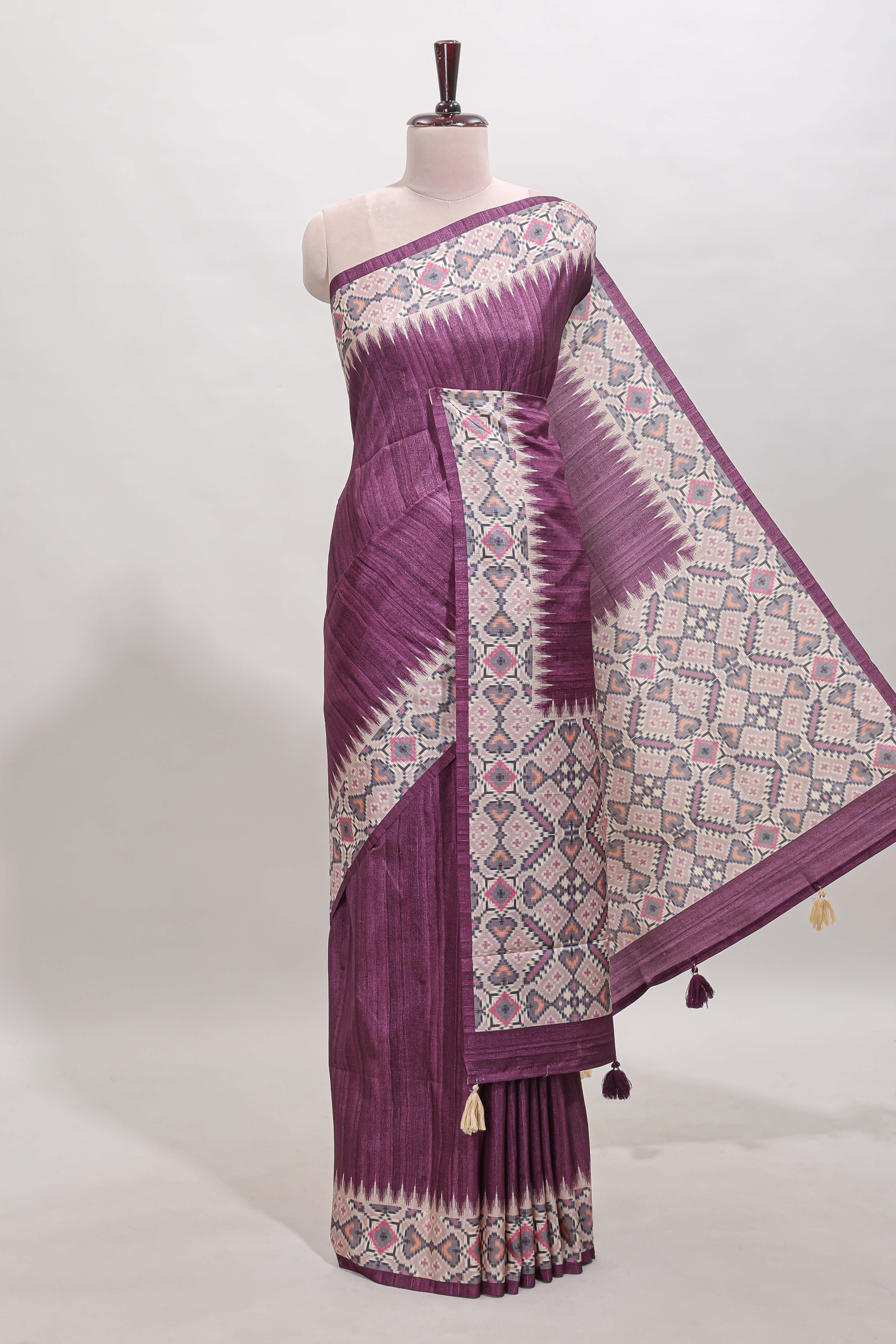 Tussar Silk Saree with a textured violet body geometric woven border and a designer pallu with tassel along with blouse