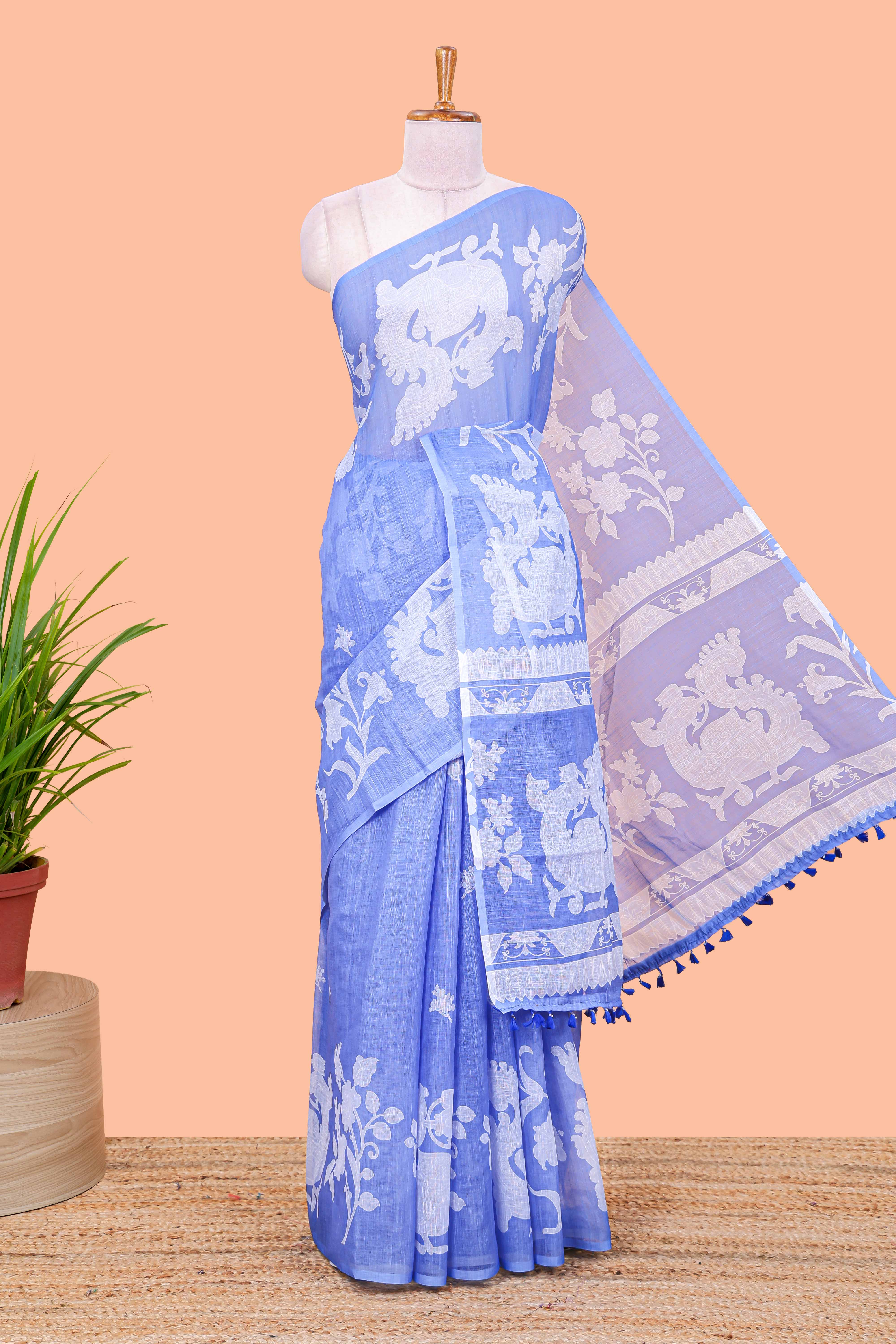 Blue linen cotton floral and birds print saree with self border and matching printed blouse
