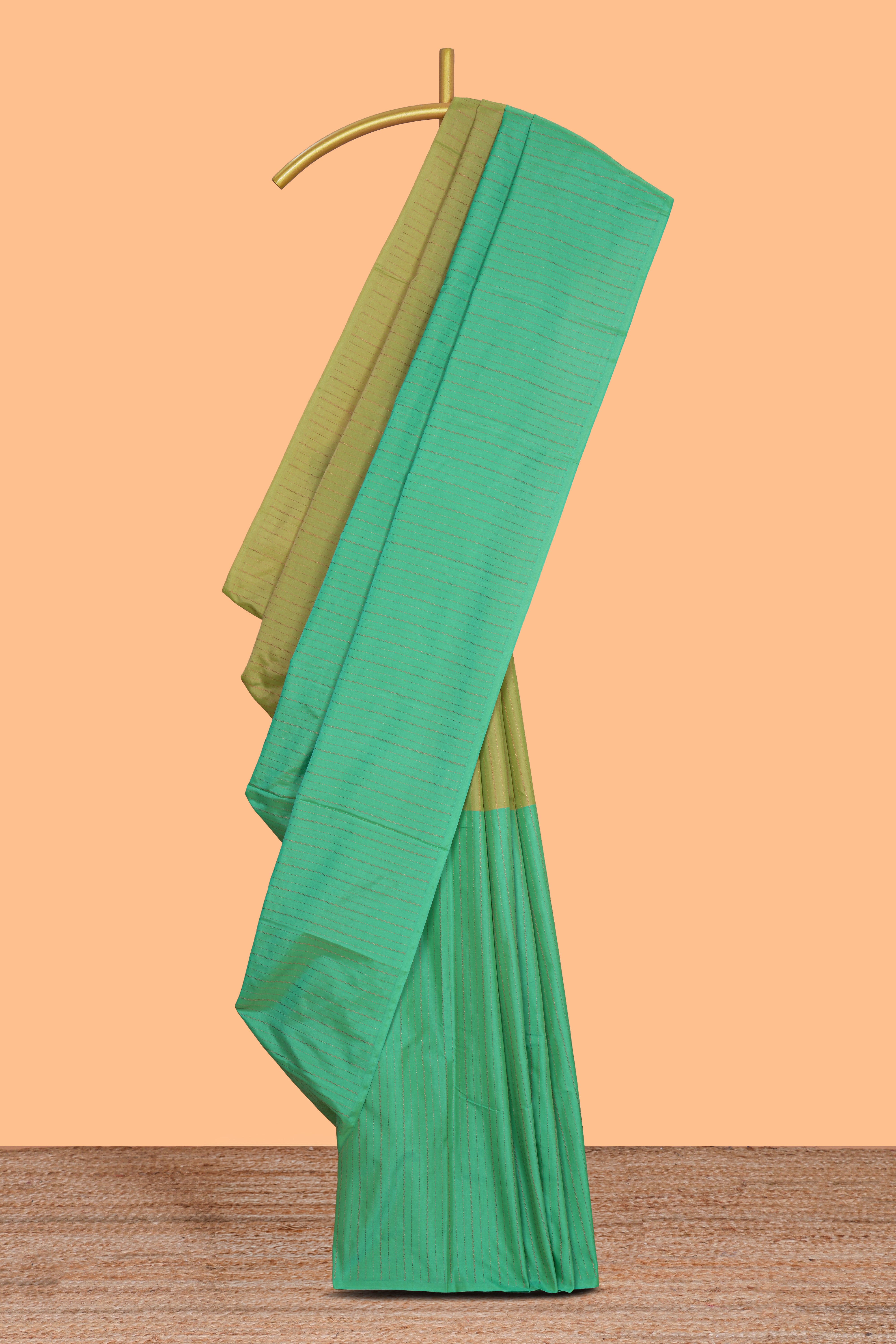 Borderless green dual tone striped design arani gift saree with self pallu and matching blouse