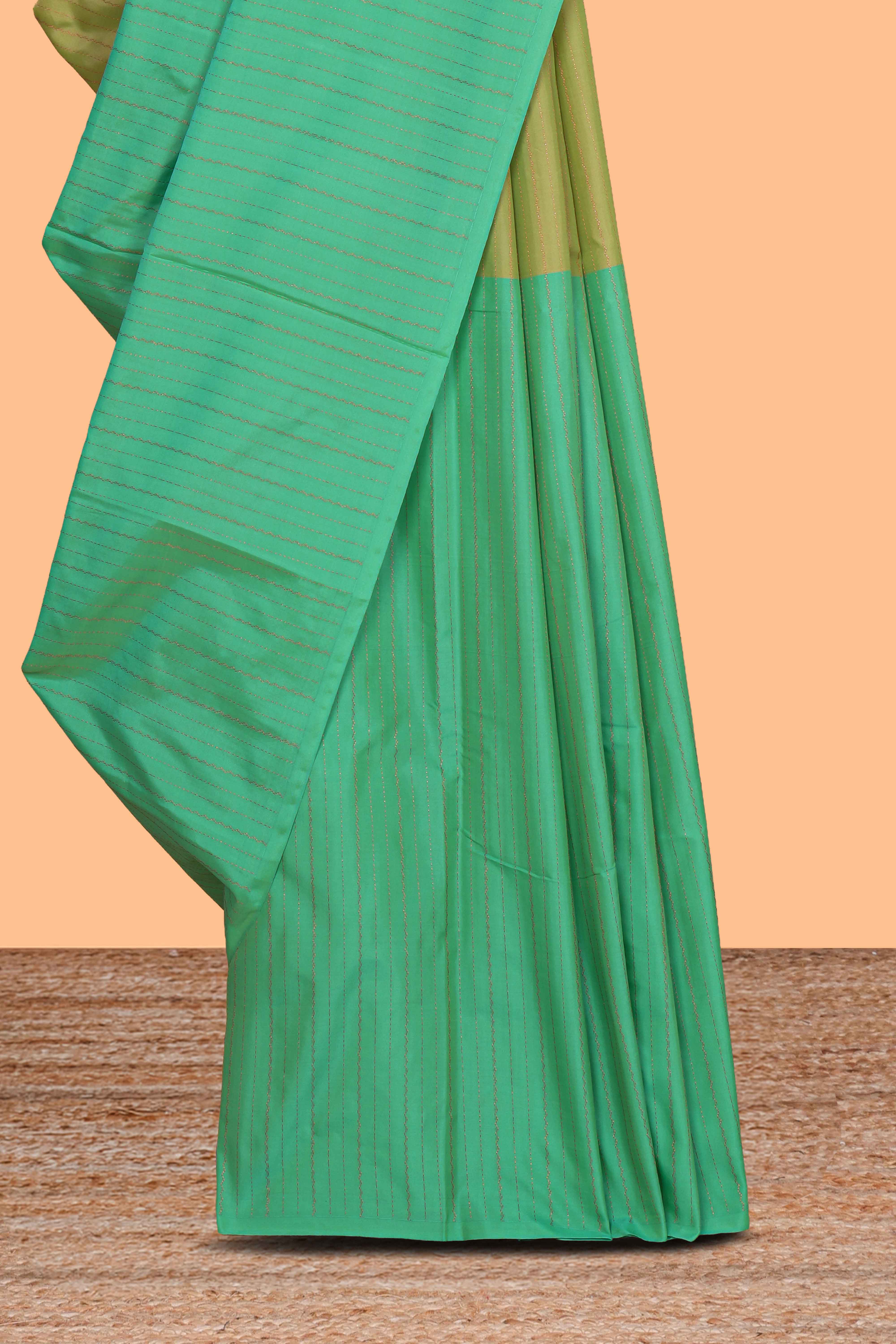 Borderless green dual tone striped design arani gift saree with self pallu and matching blouse