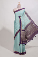 Light blue art mysore silk saree with retta petta contrast border and rich pallu with plain blouse