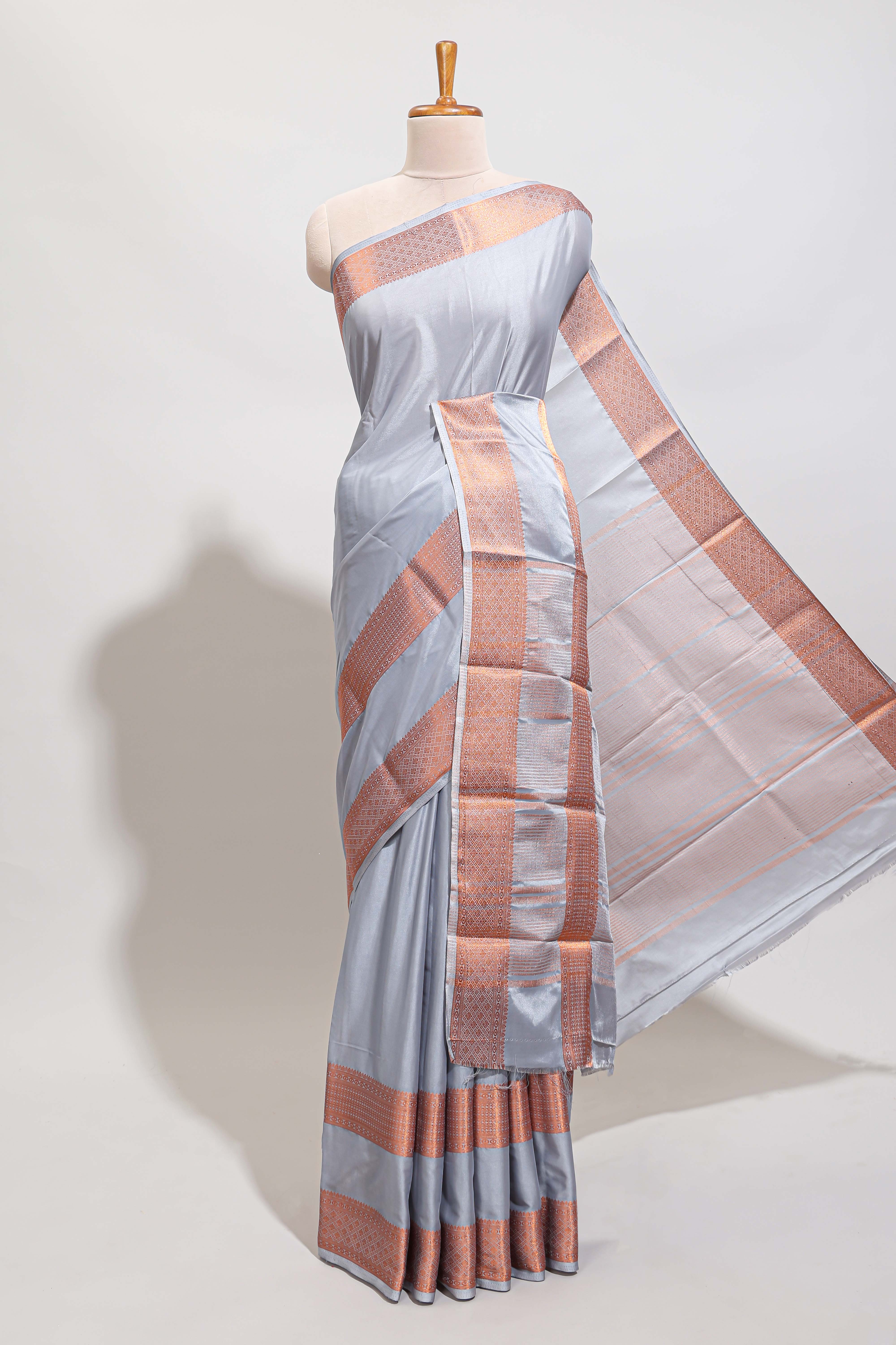 Sky blue plain art mysore silk saree with contrast zari border and matching blouse