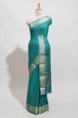 Green plain art mysore silk saree with self zari border and matching blouse