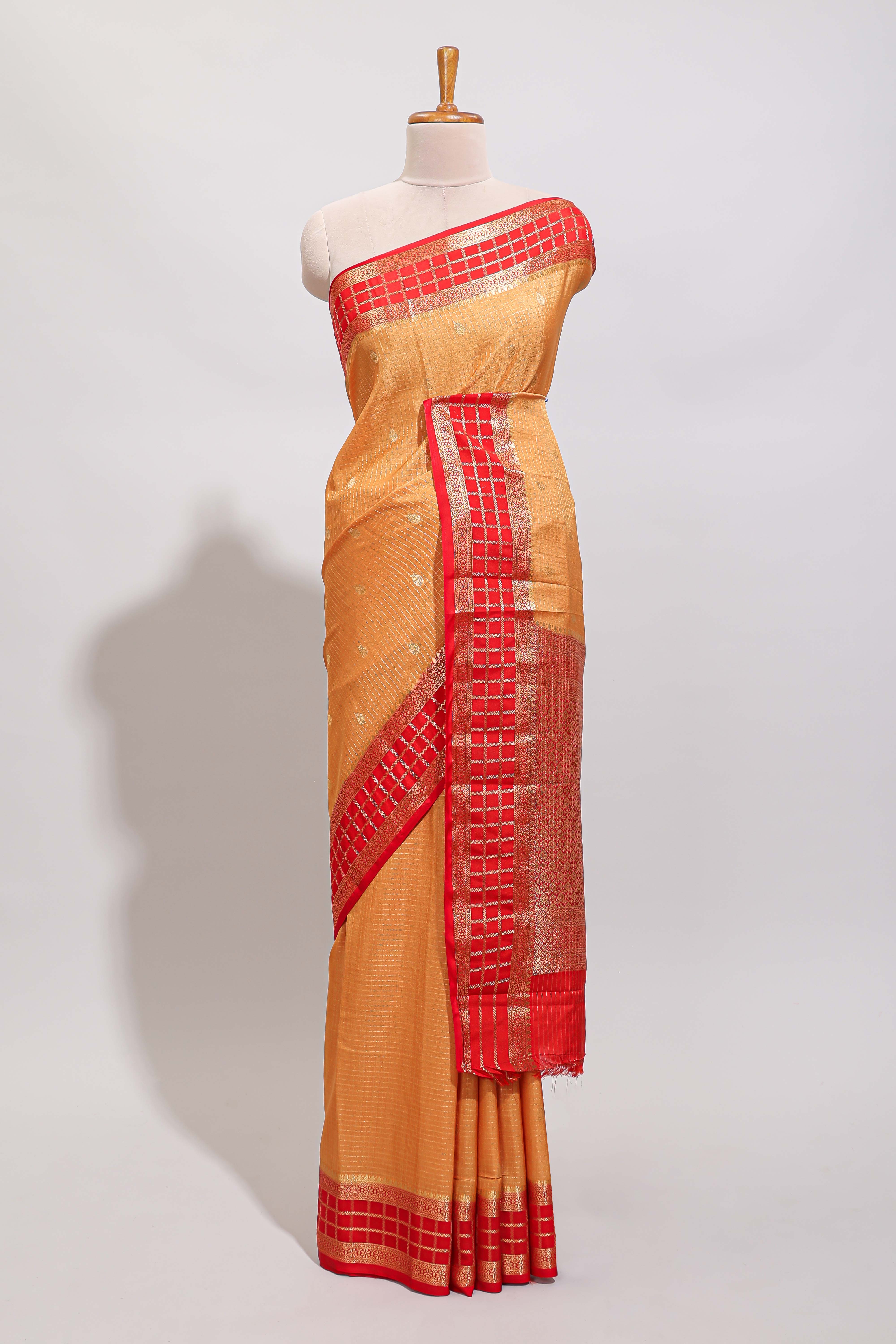 Orange checked zari motifs art mysore silk saree with contrast zari border and checked blouse