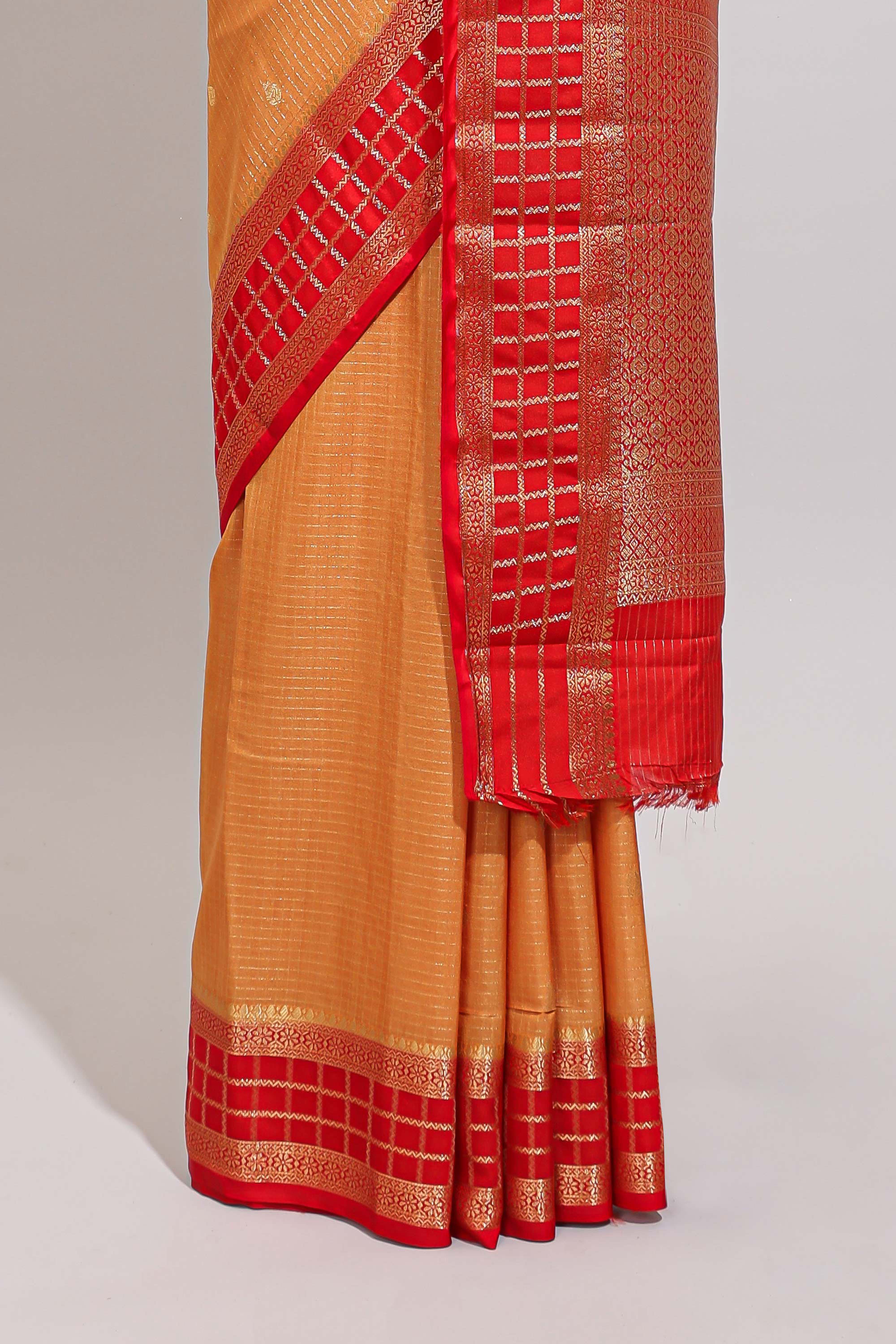 Orange checked zari motifs art mysore silk saree with contrast zari border and checked blouse
