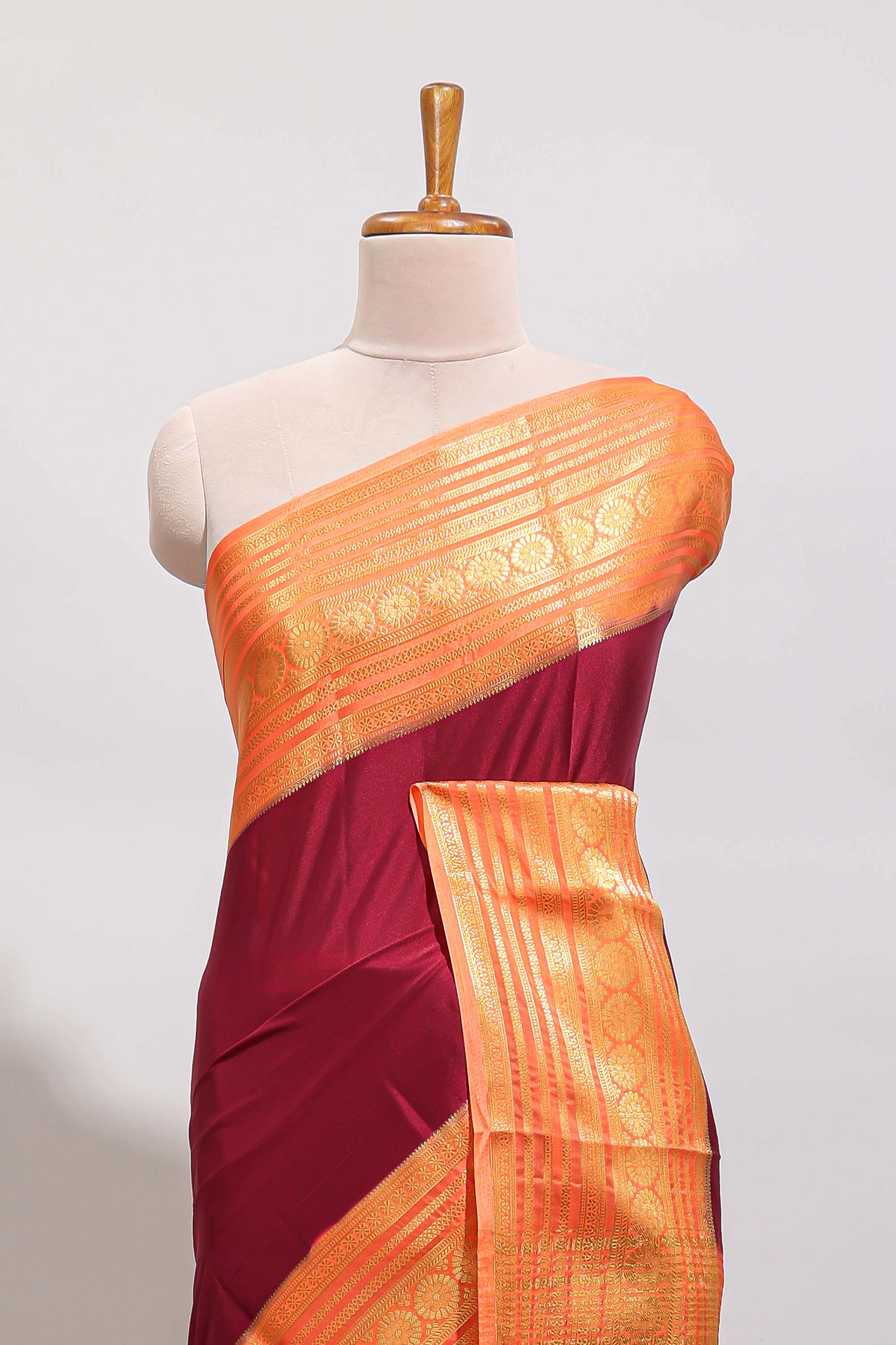 Maroon plain art mysore silk saree with contrast zari border and blouse