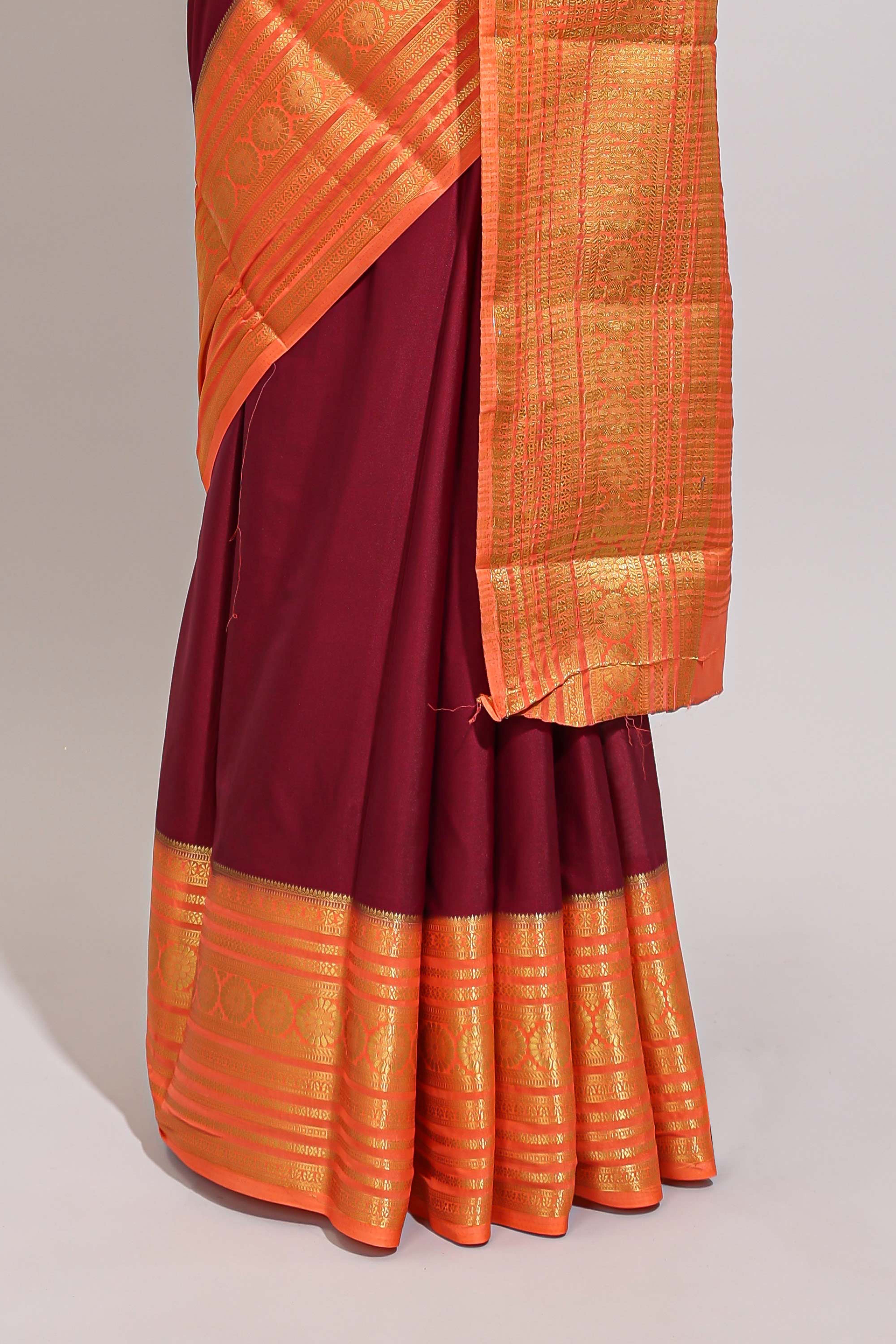 Maroon plain art mysore silk saree with contrast zari border and blouse